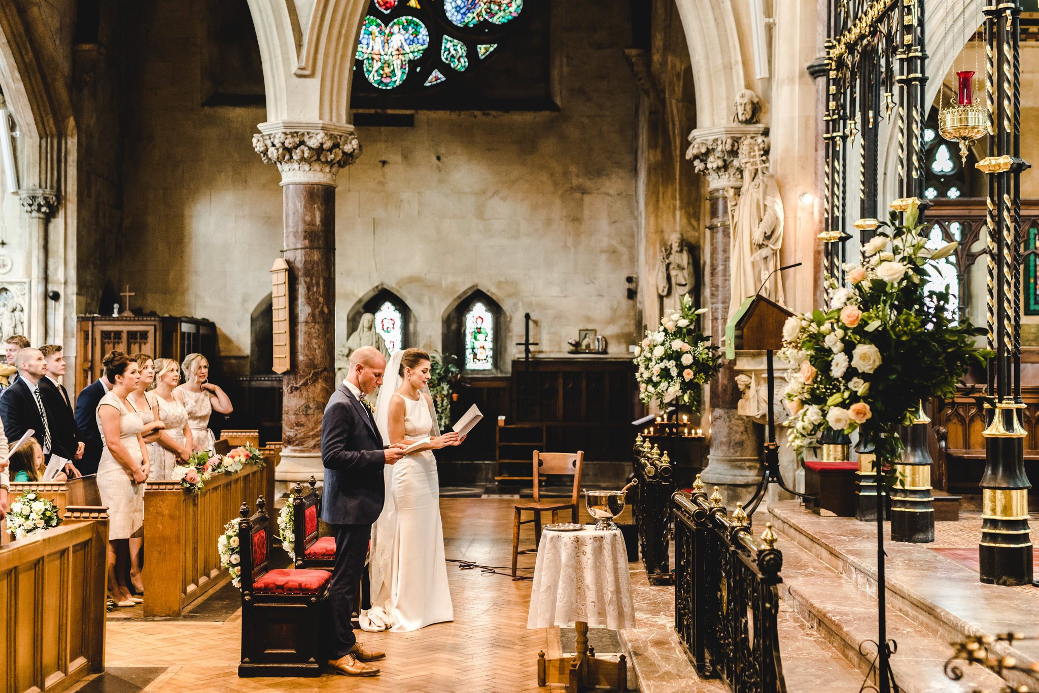 bride and groom singing hymns at their wedding ceremony