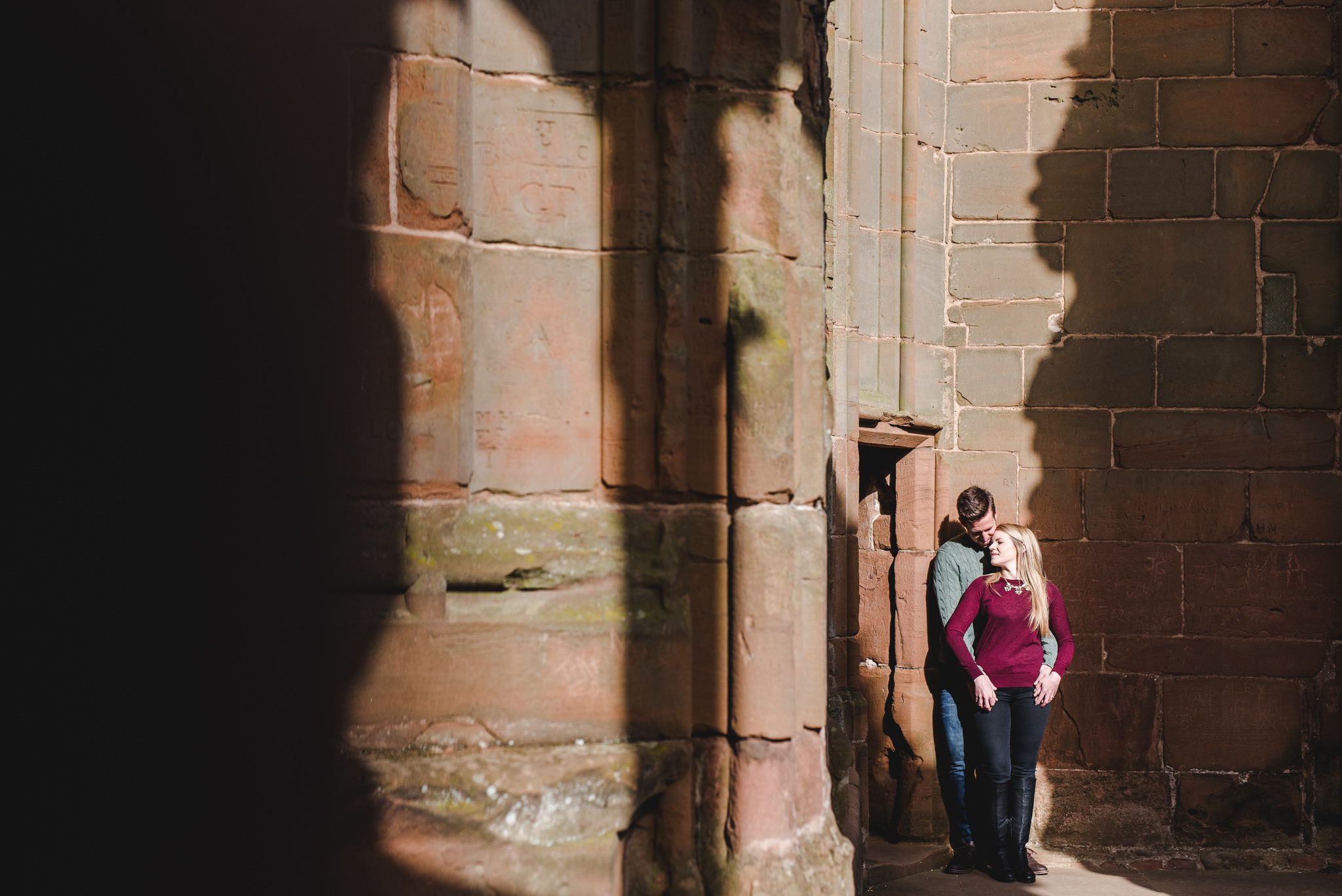 A couple preparing for their wedding photography at Kenilworth Castle