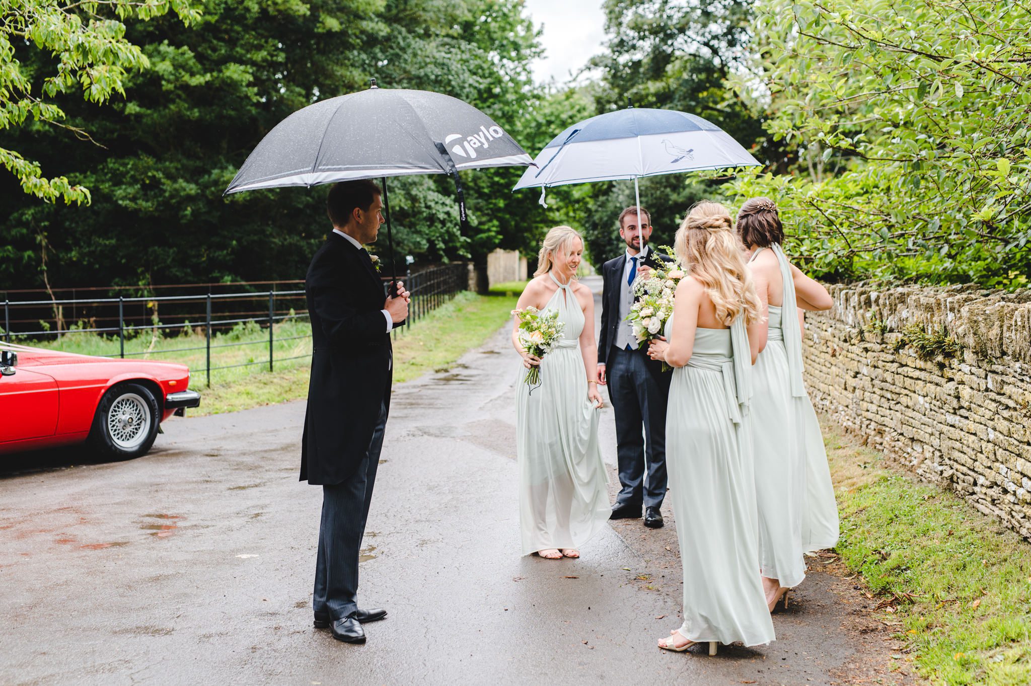 Bridesmaids under umbrellas
