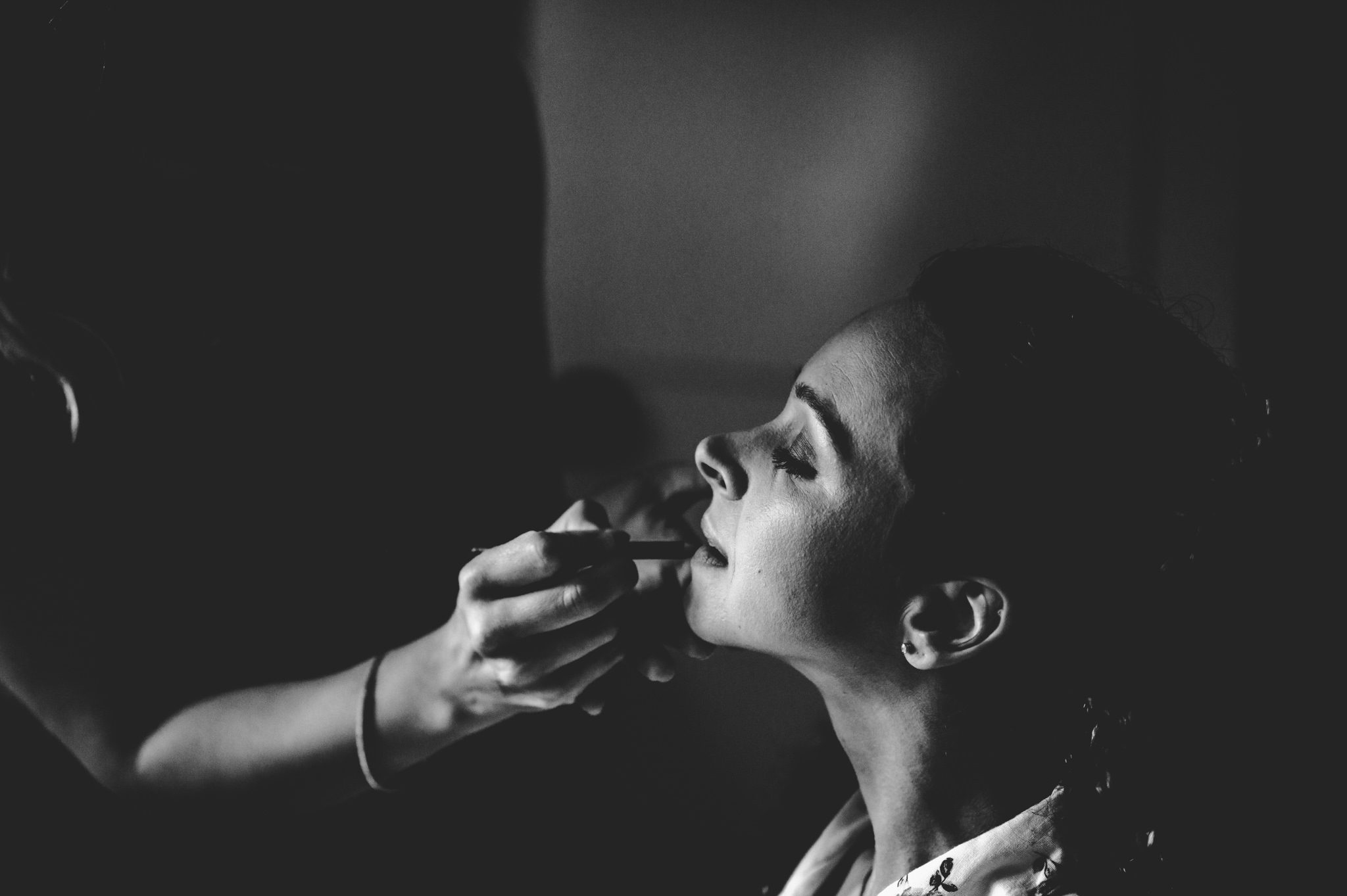 A bride having her make up applied in The Hare & Hounds Tetbury