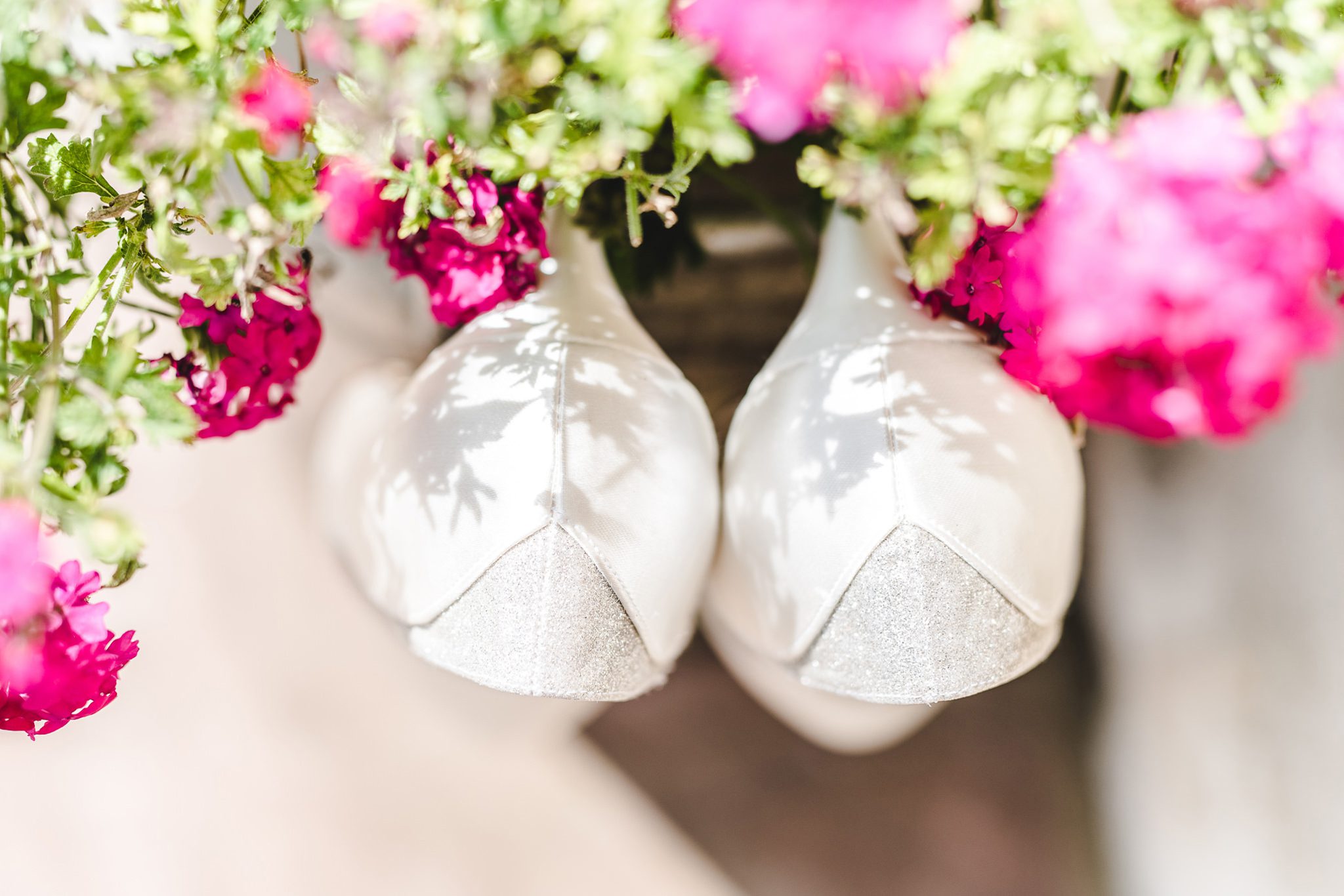 Wedding shoes hanging on a plant pot
