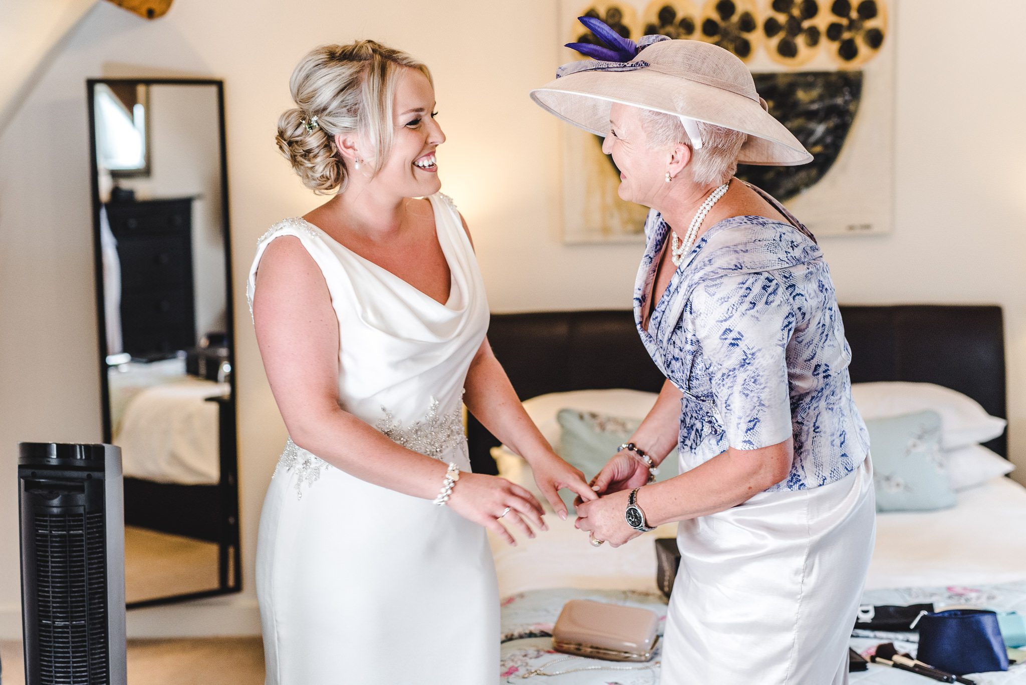 A bride and her mum laughing