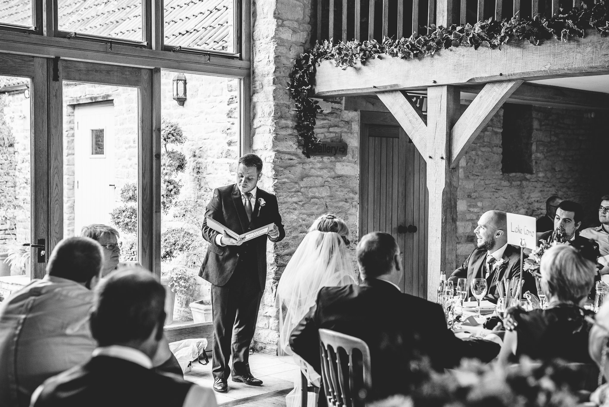 A best man delivering speeches at Kingscote Barn