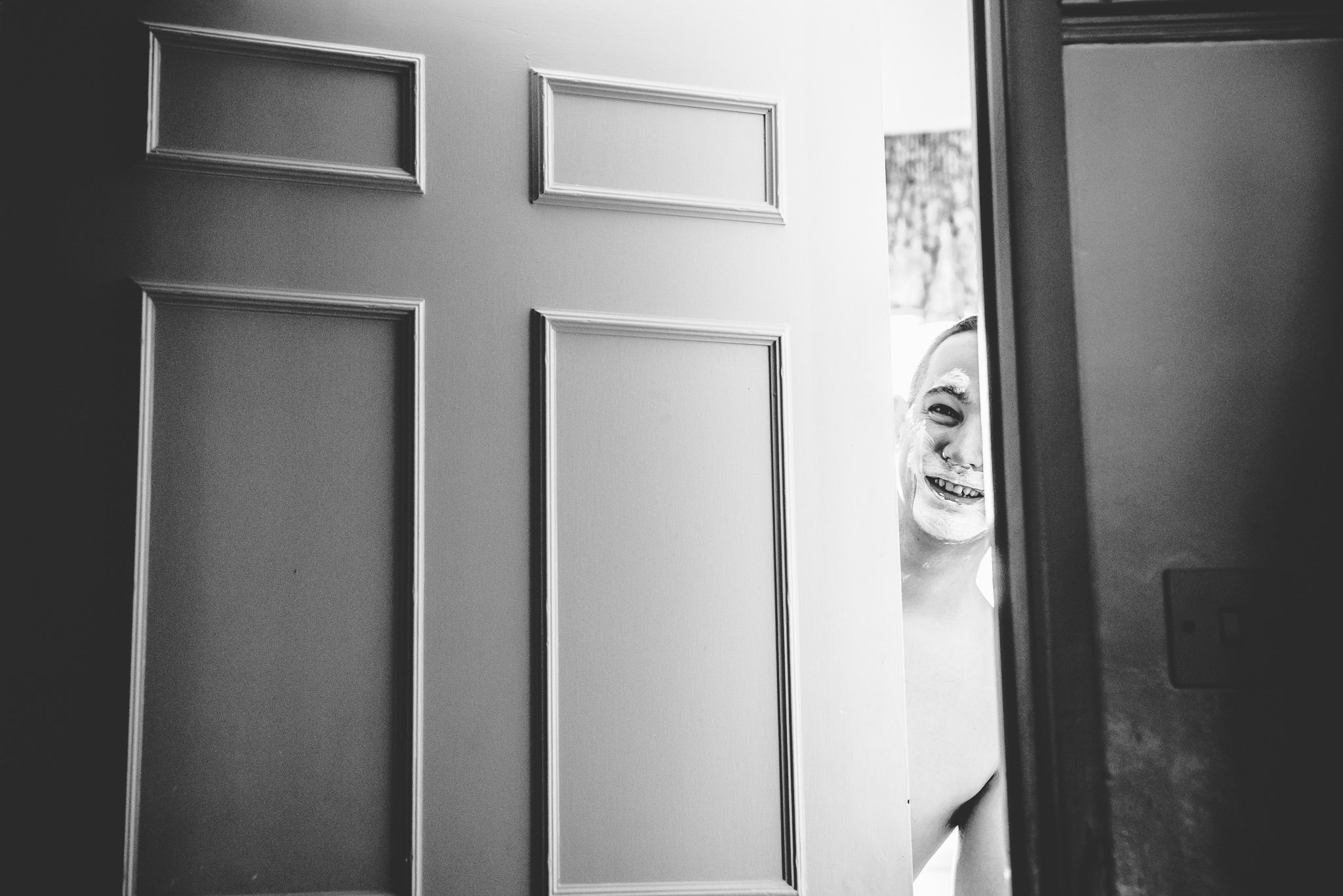 A Stone Barn groom having a shave before his Gloucestershire wedding