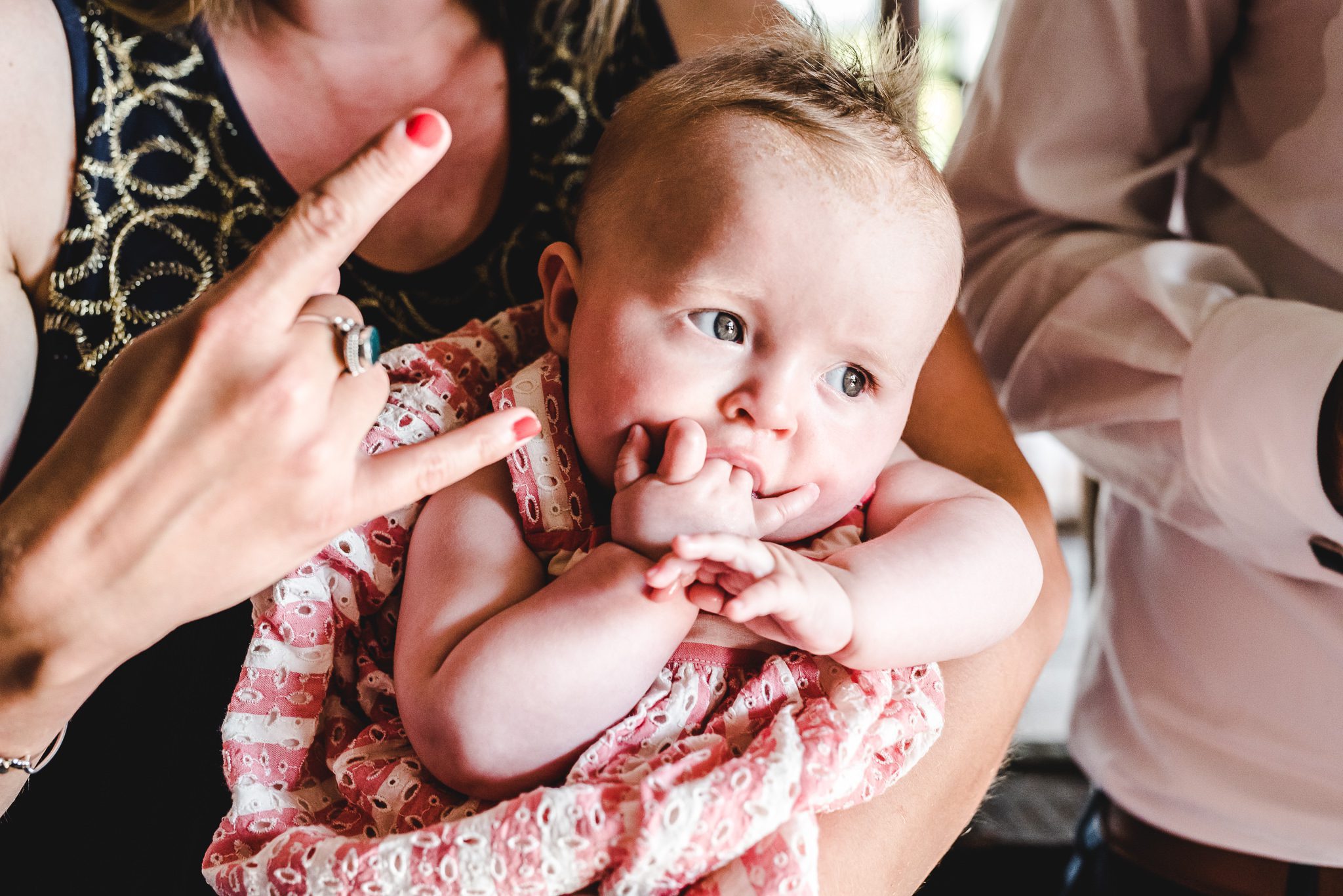 Baby chewing fingers death metal rock sign