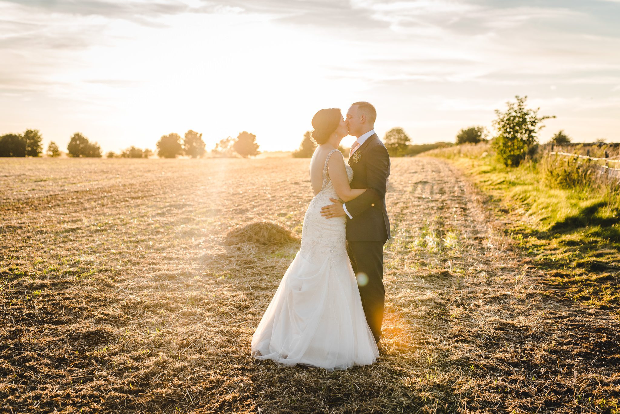 Sunset photographs of bride and groom by Bigeye Photography