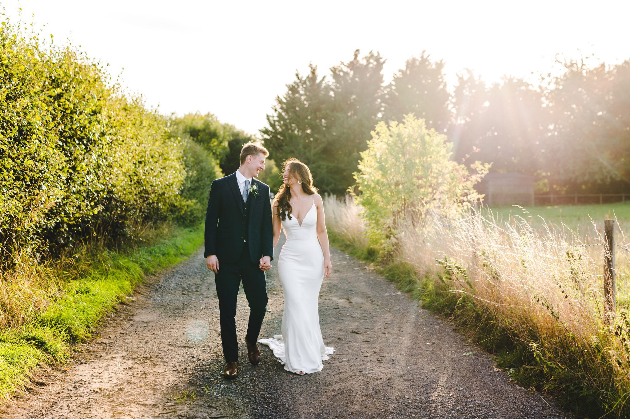 A couple walking at the great tythe barn