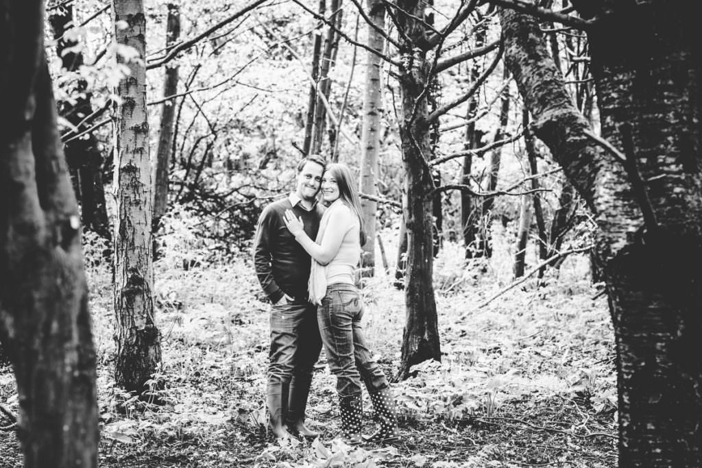 A black and white image of a couple in a field
