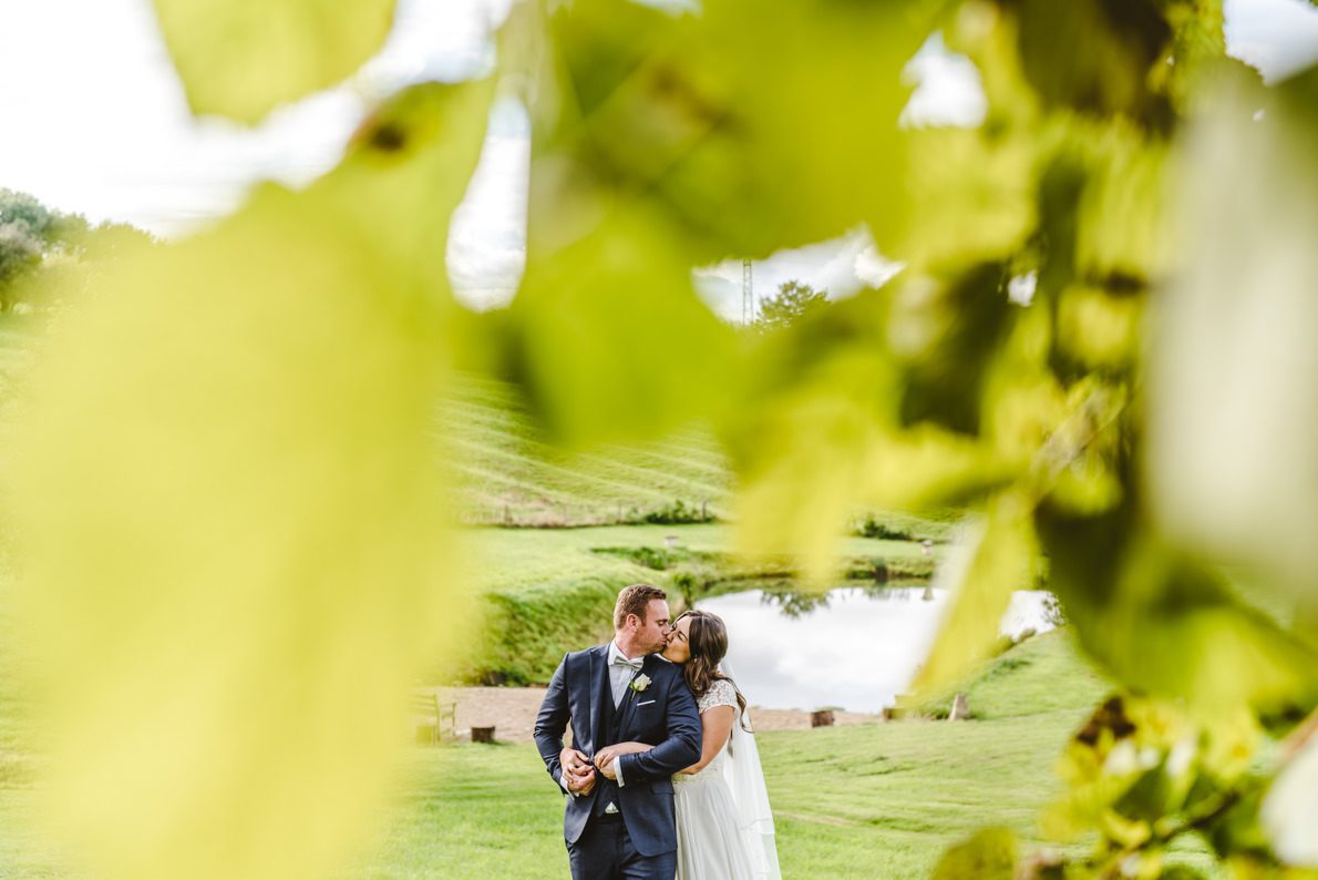 A couple kissing under a tree at a Middle Stanley Wedding