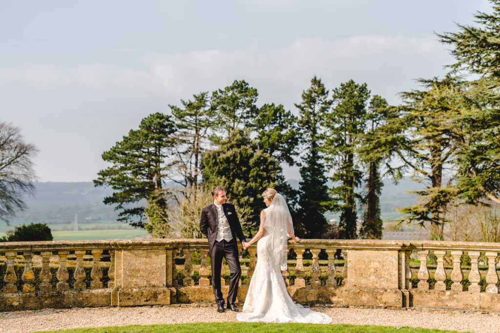 A Coombe Lodge couple standing on the balistrade