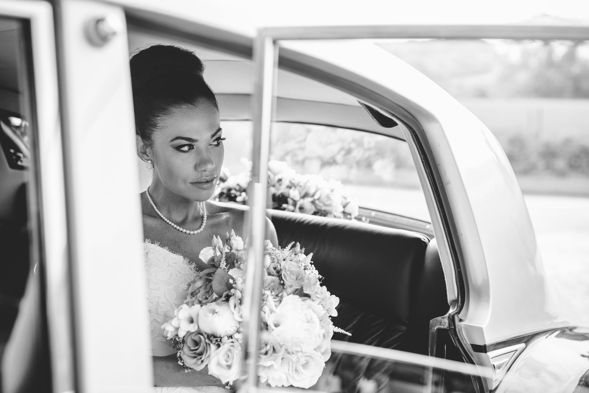 Bride arriving in her wedding car at The Barn at Upcote