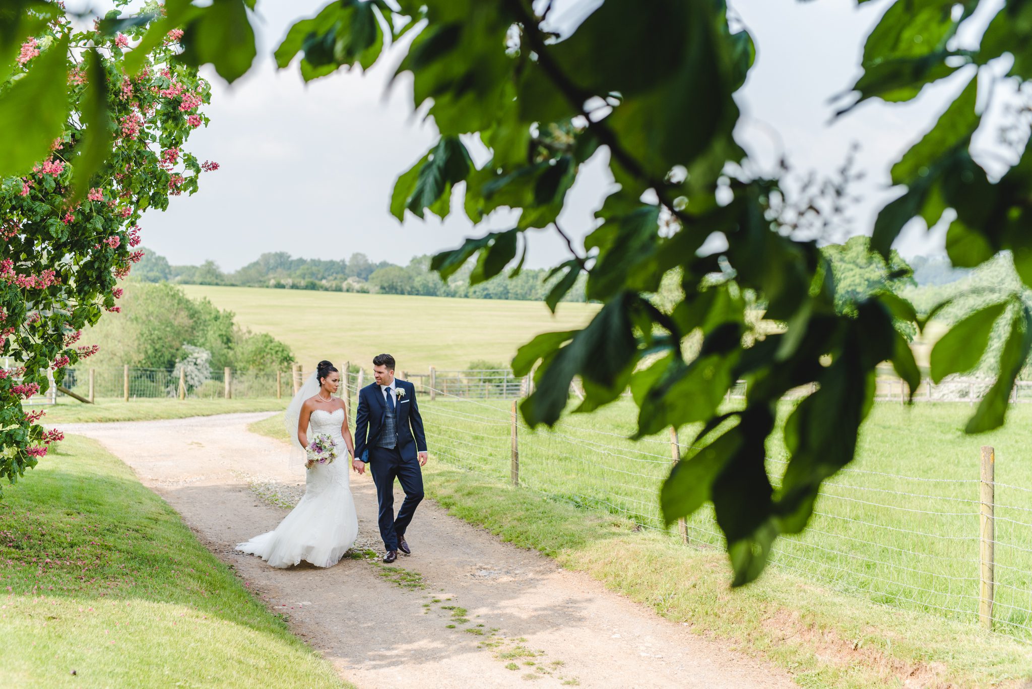 Couple walking in the sunshine at upcote by Bigeye Photography