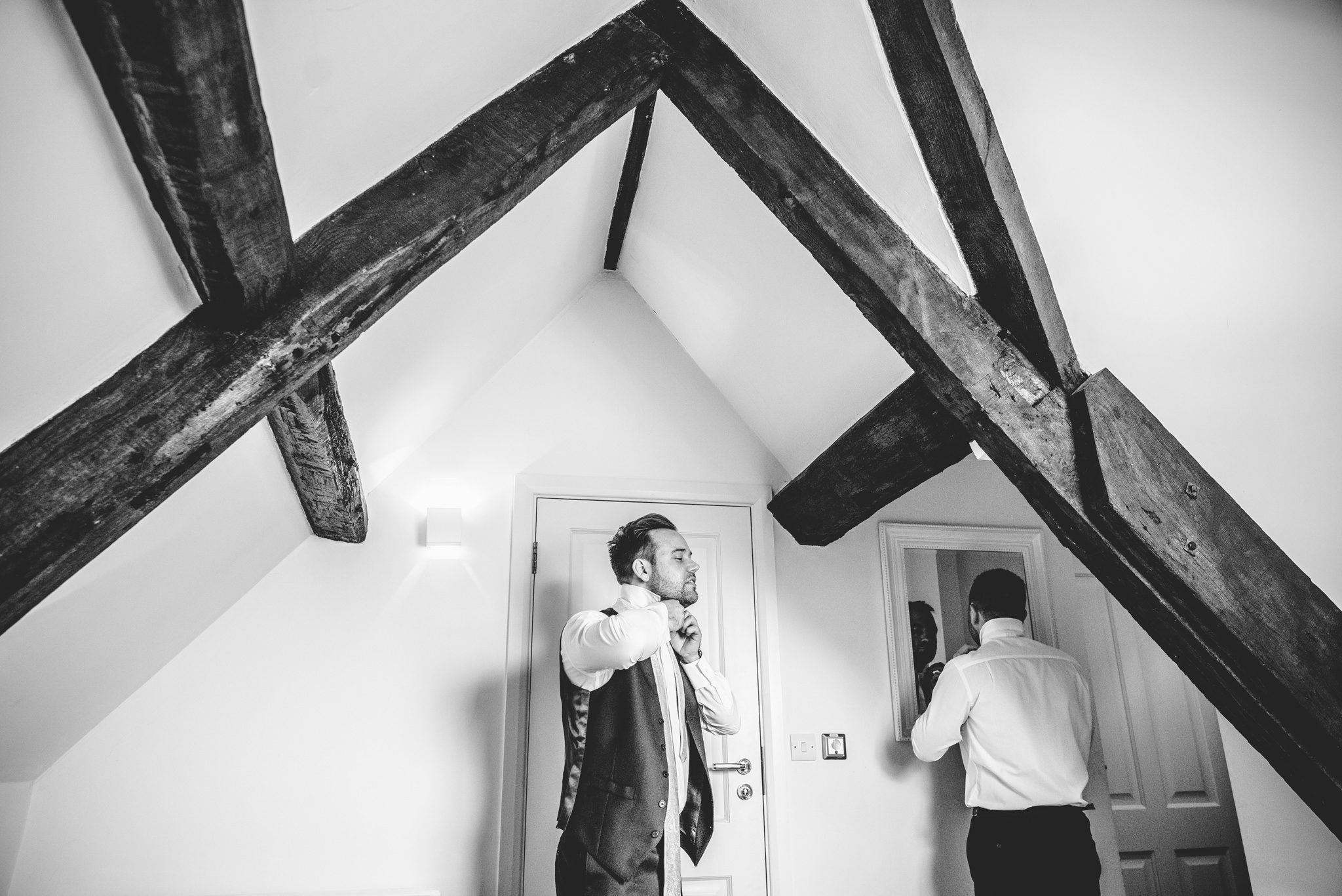 Groom at Great Tythe Barn doing his tie up