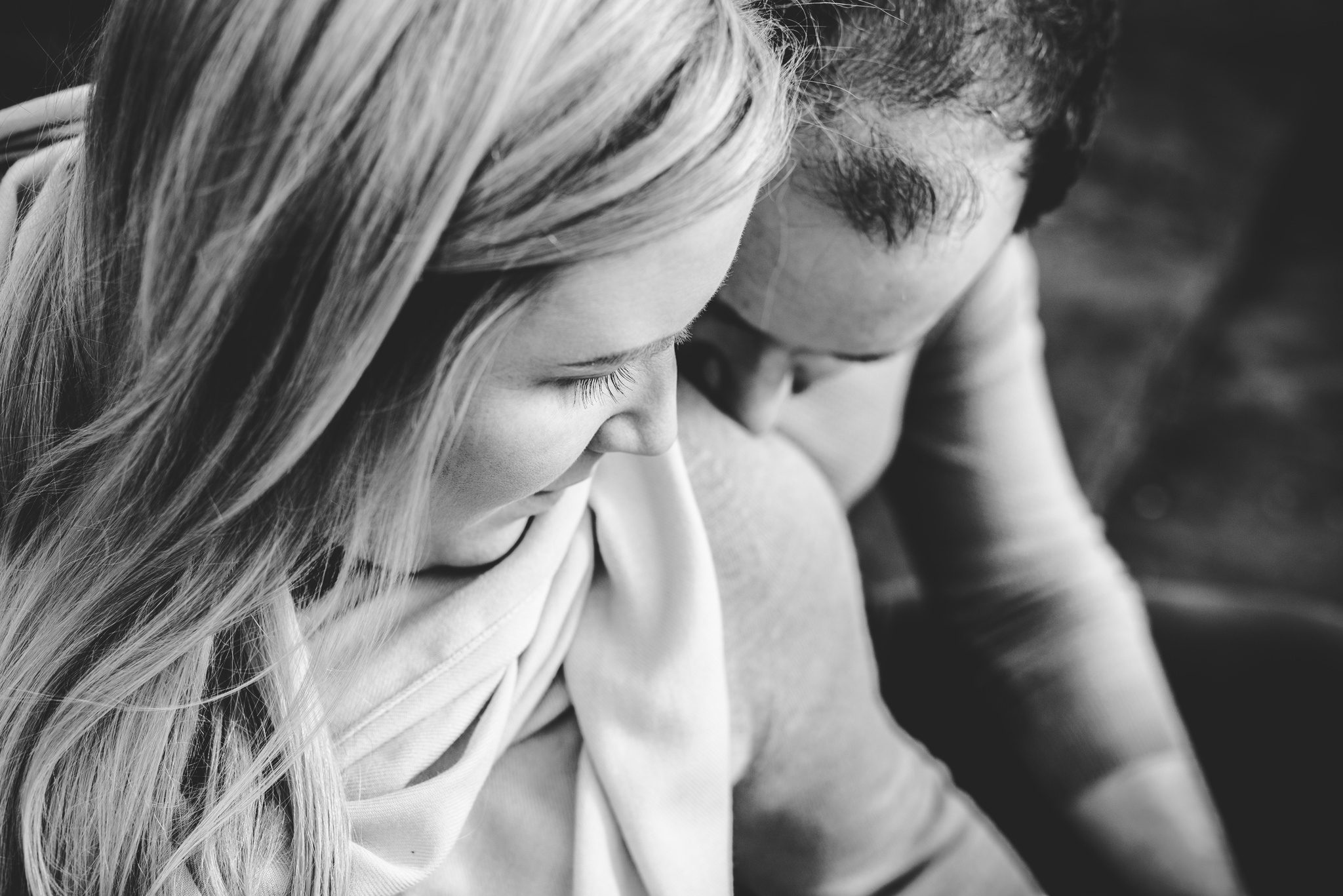 A black and white image of a couple from above