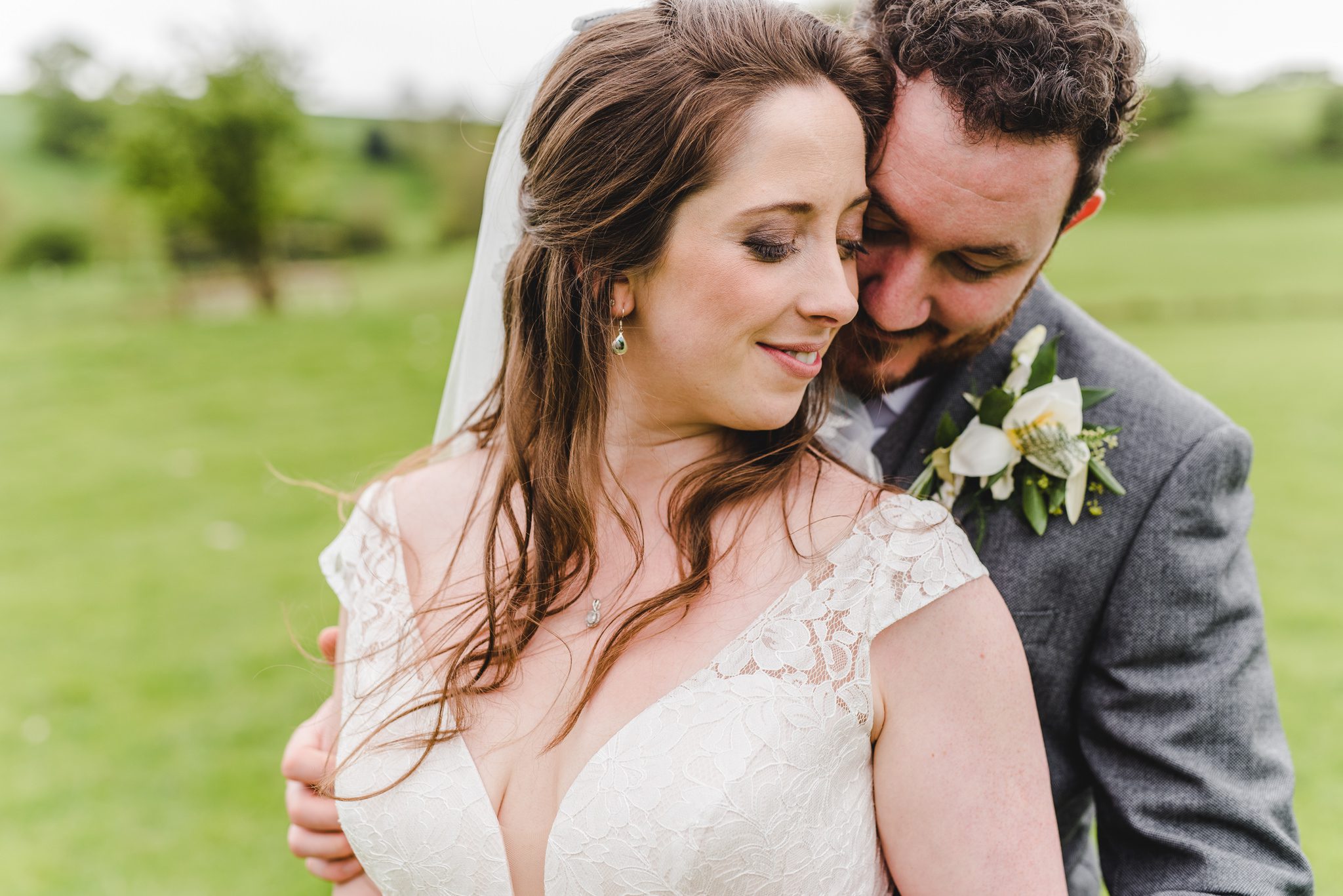 Close up of bride and groom together - Kingscote Barn wedding photographs
