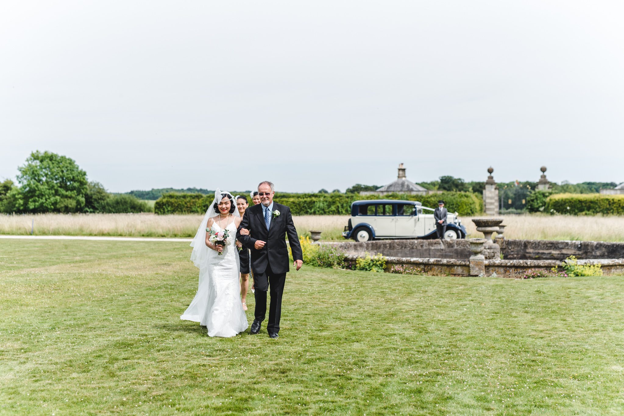 Bride and father walking to the aisle