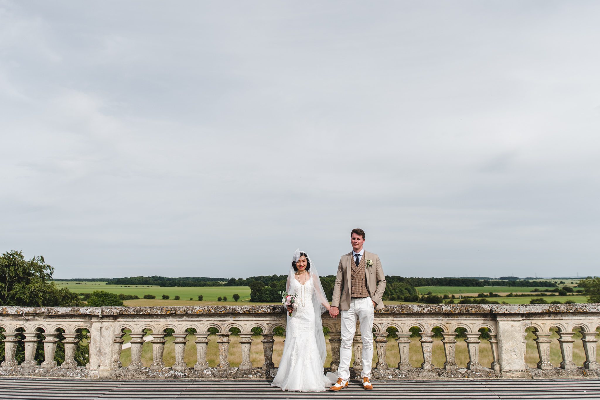 Bride and Groom on the roof at Lodge Park