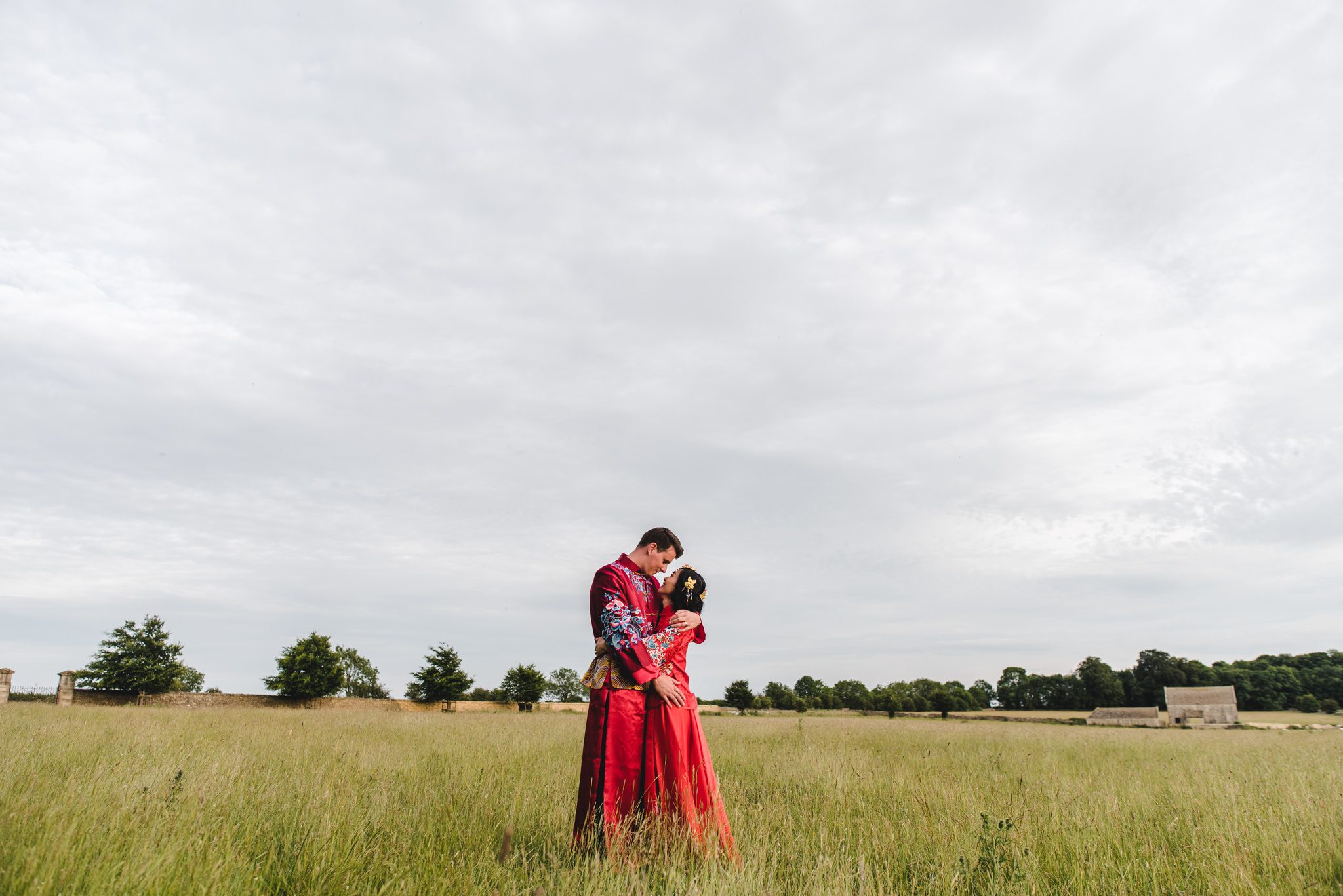 Bride and Groom in tradional chinese dress at a Gloucestershire wedding