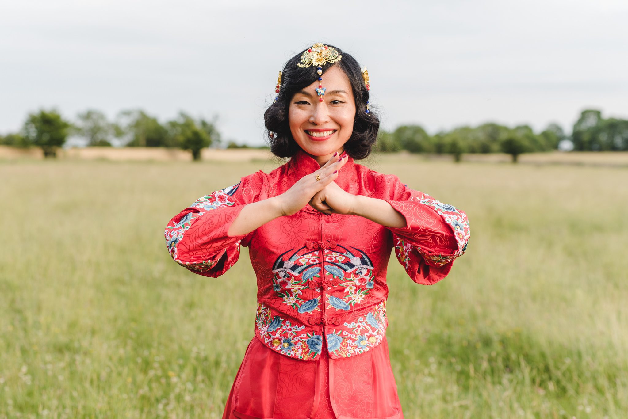 Bride in tradional chinese dress at Lodge Park wedding venue