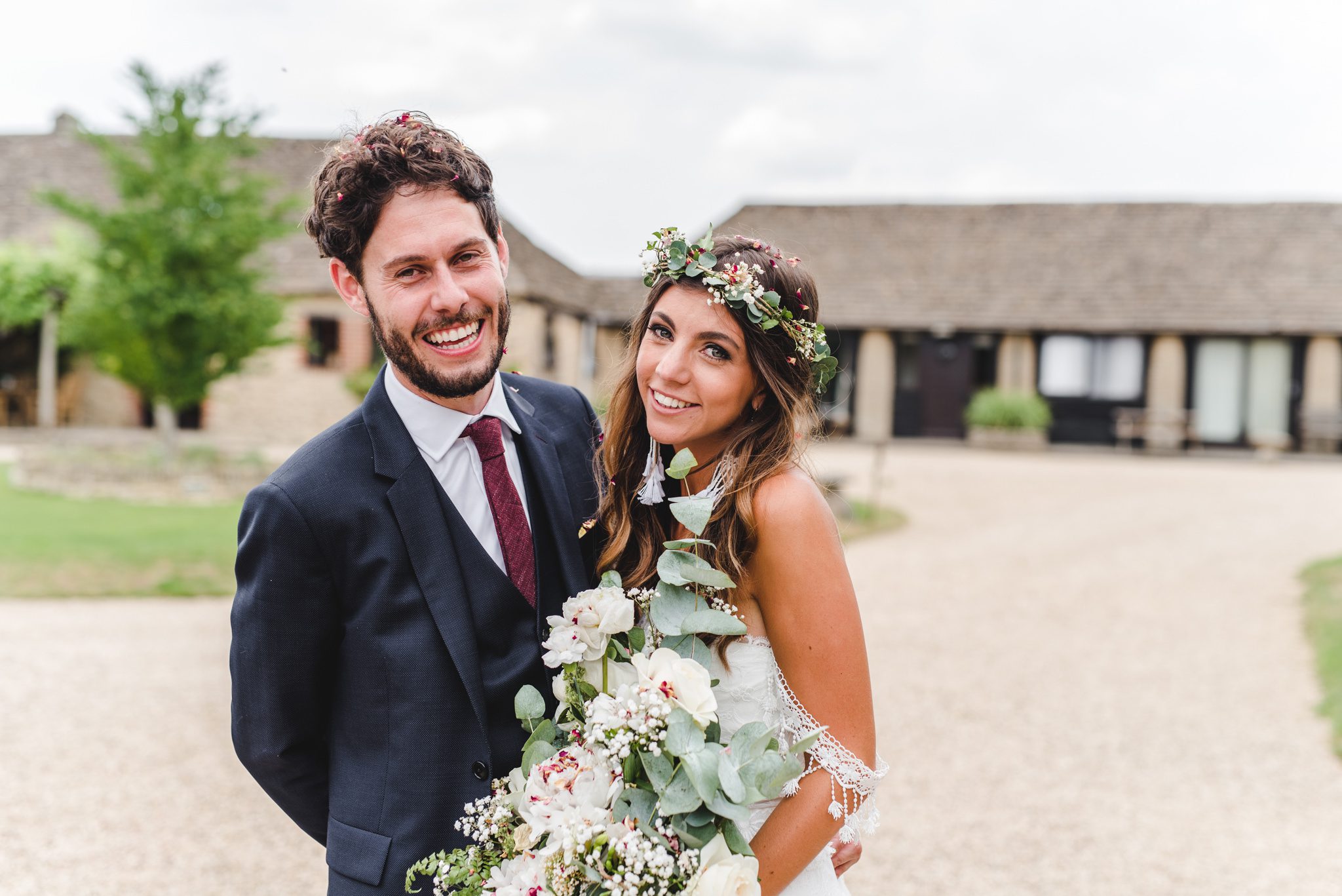 Bride and Groom smiling at the camera