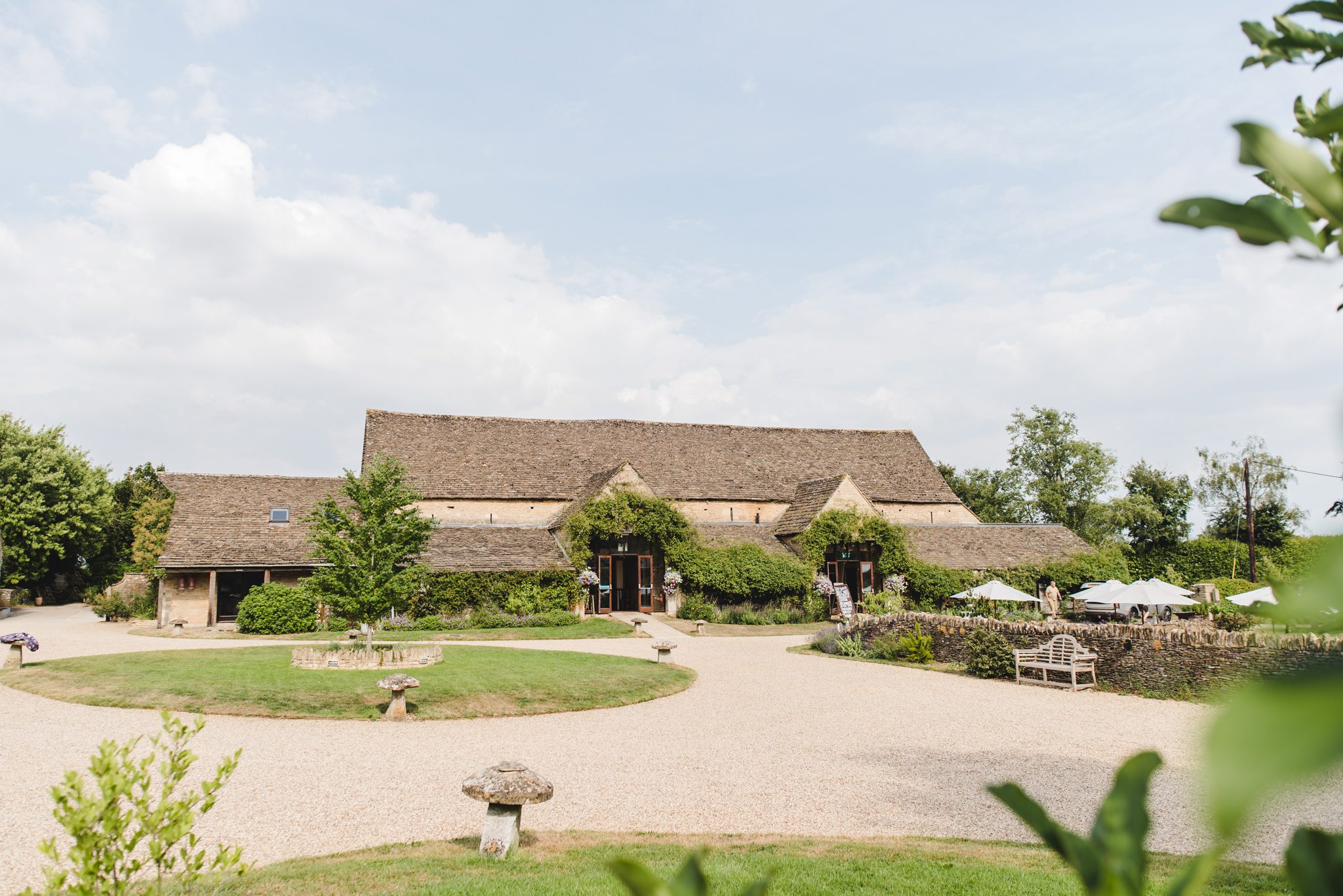 wide view of the great tythe barn wedding venue in Tetbury