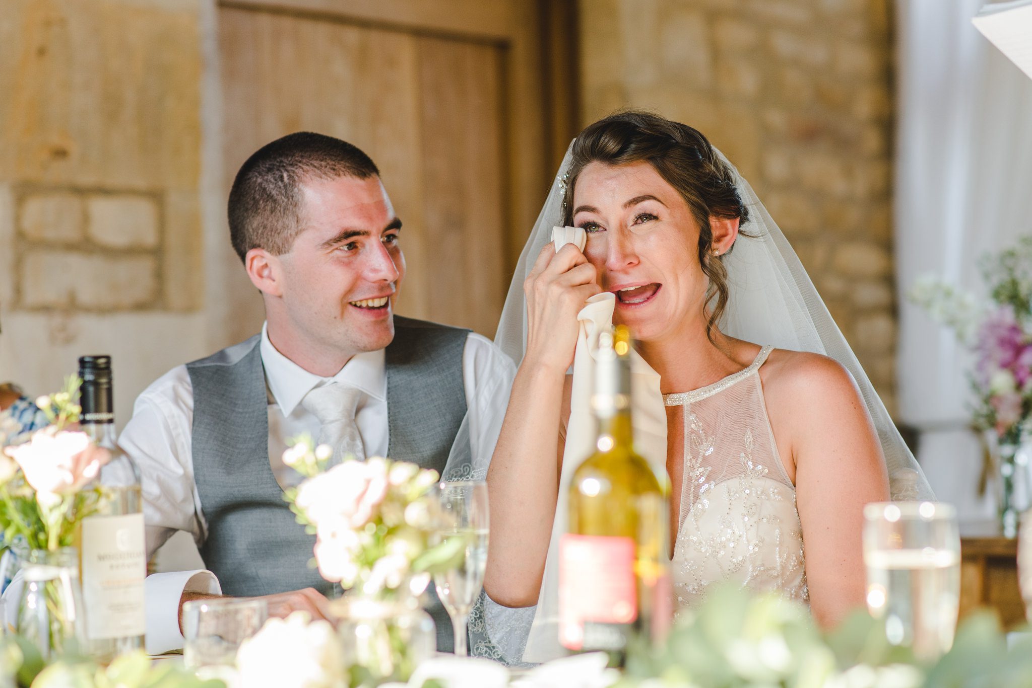 bride wiping a tear from her eye