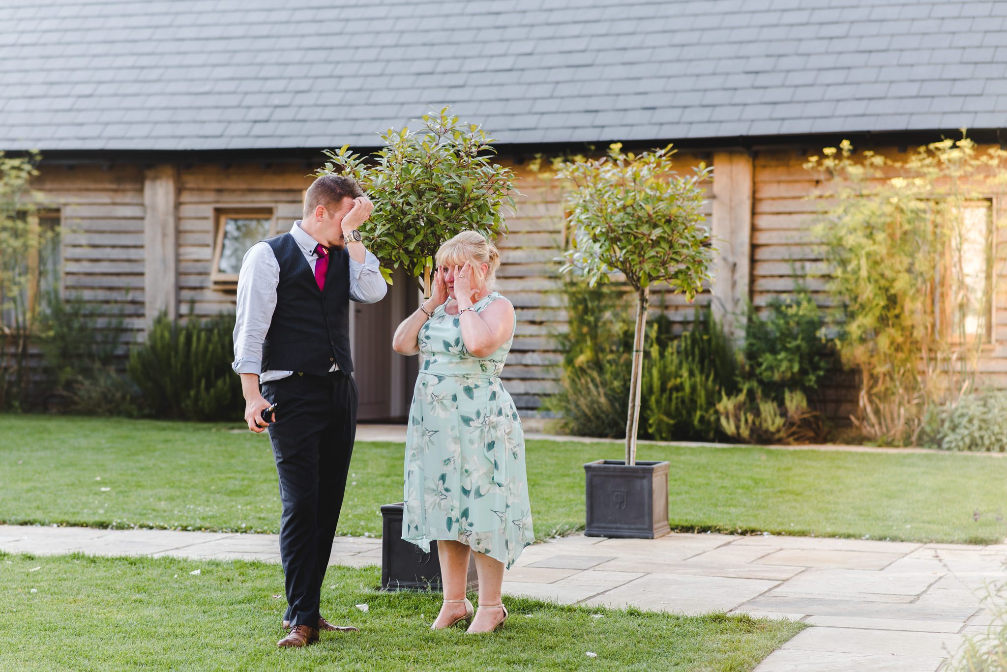 Wedding guests wiping tears from their eyes after speeches