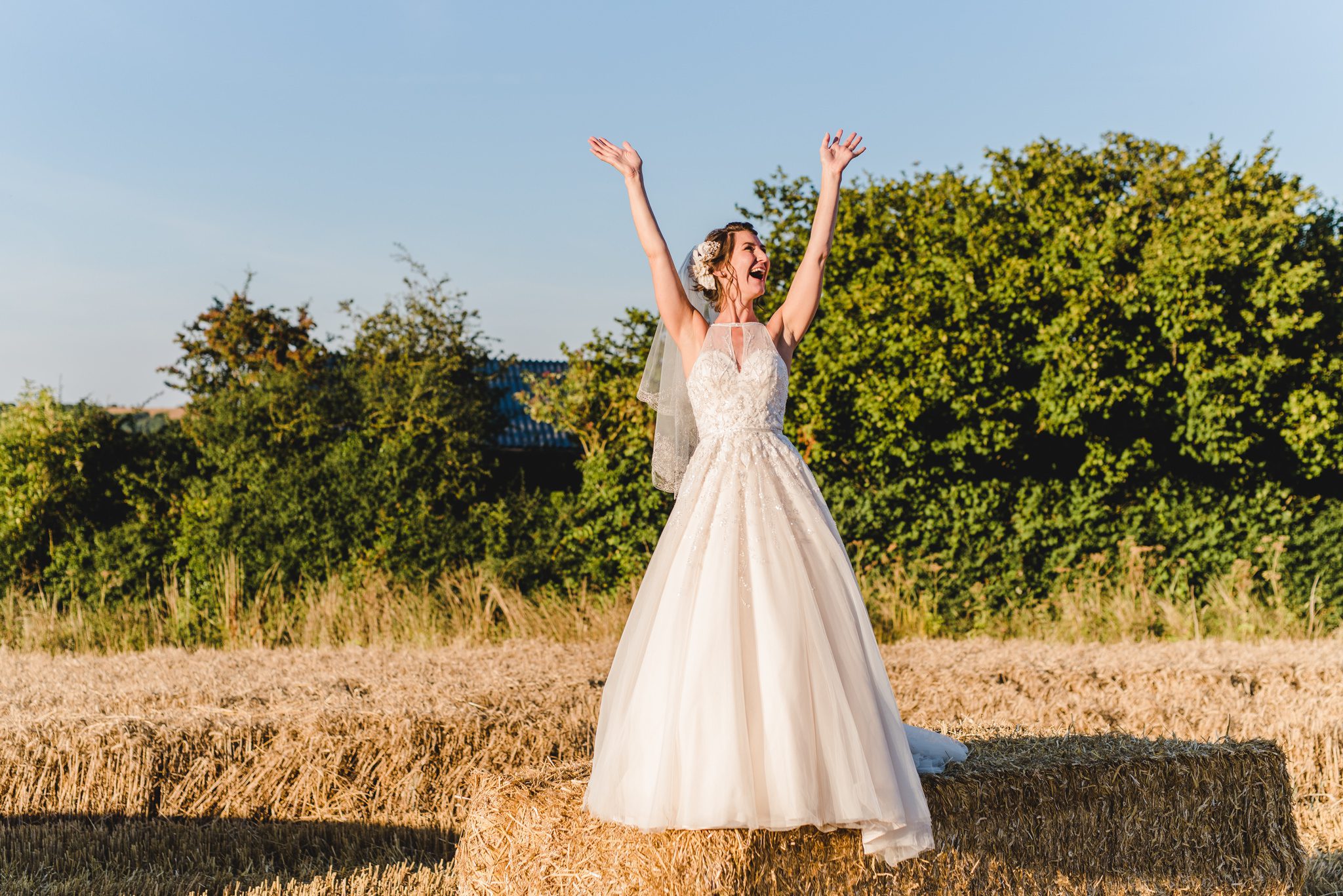 Bride happy with her arms in the air