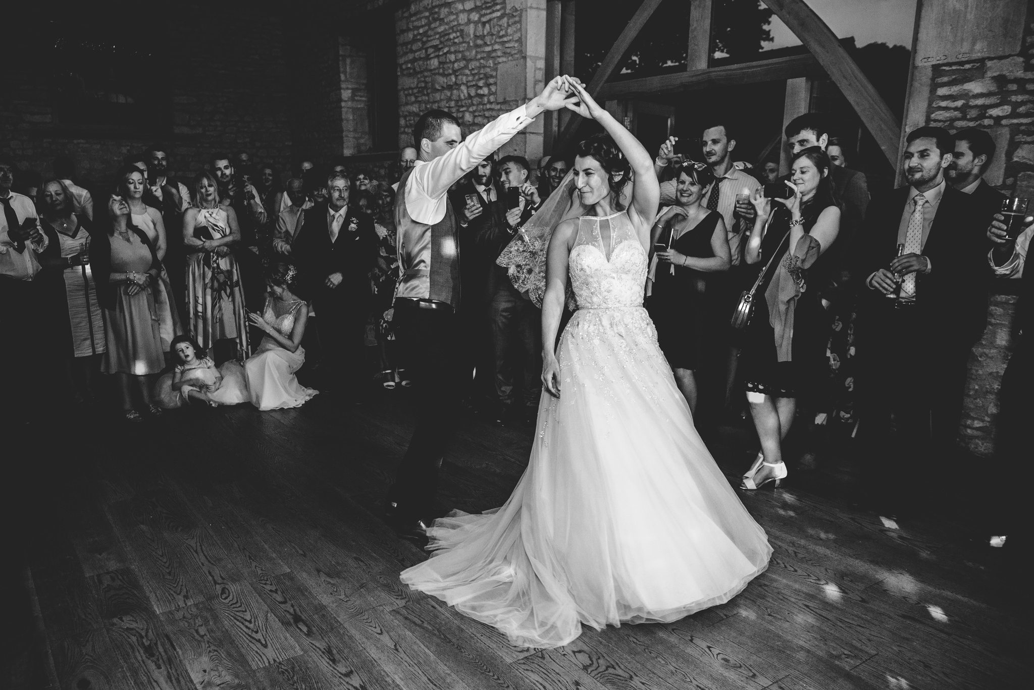 Groom twirling bride