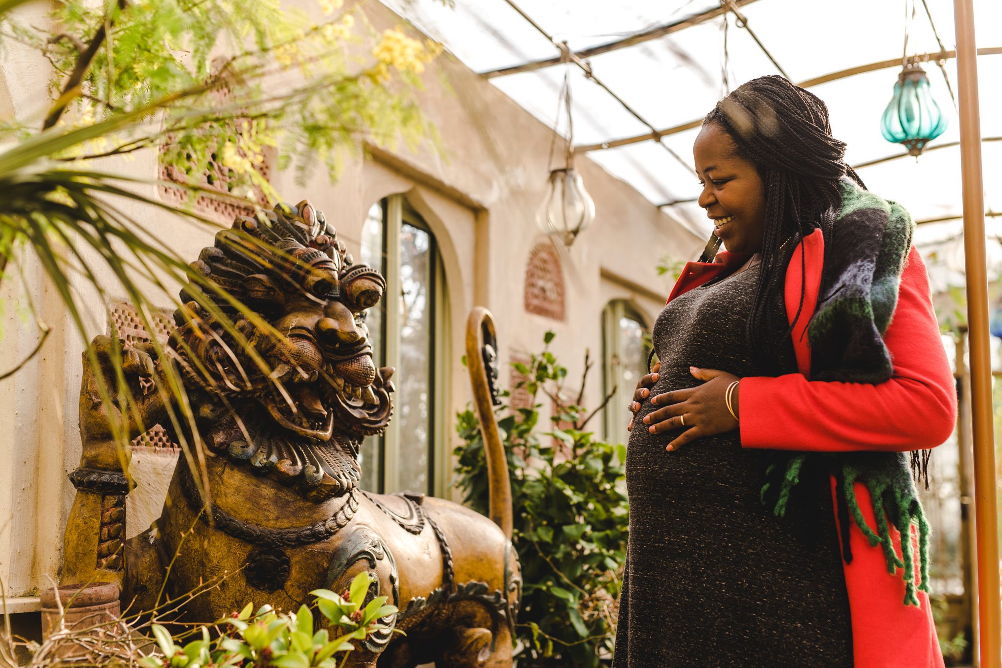 A lion statue being shocked at a pregnant bump