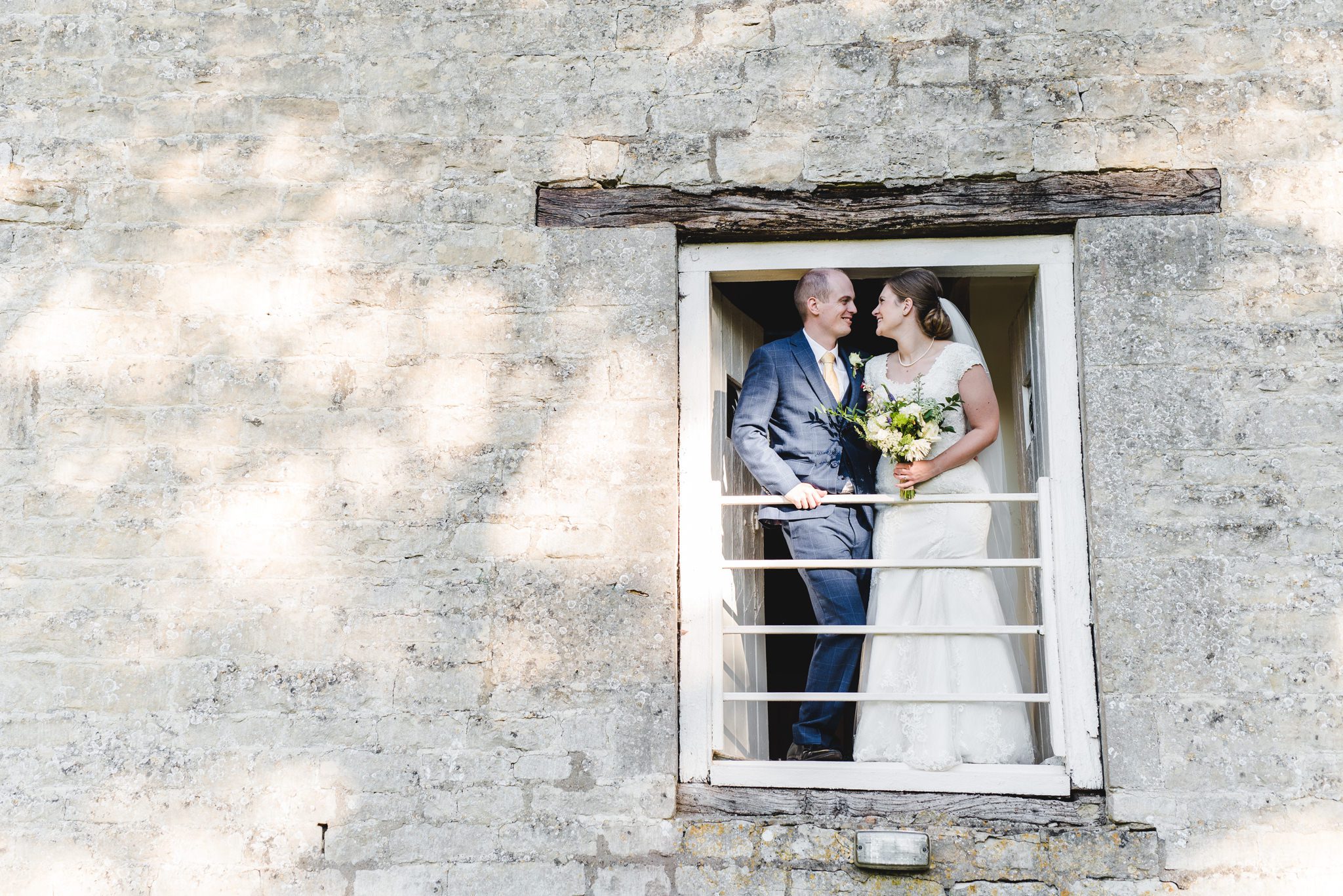Bride and Groom on a balcony at Owlpen Manor
