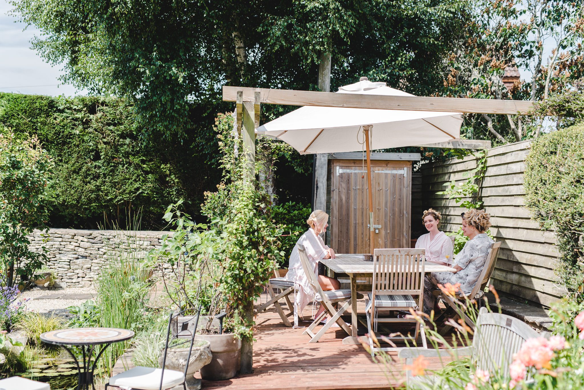 Girls relaxing in a garden before a wedding