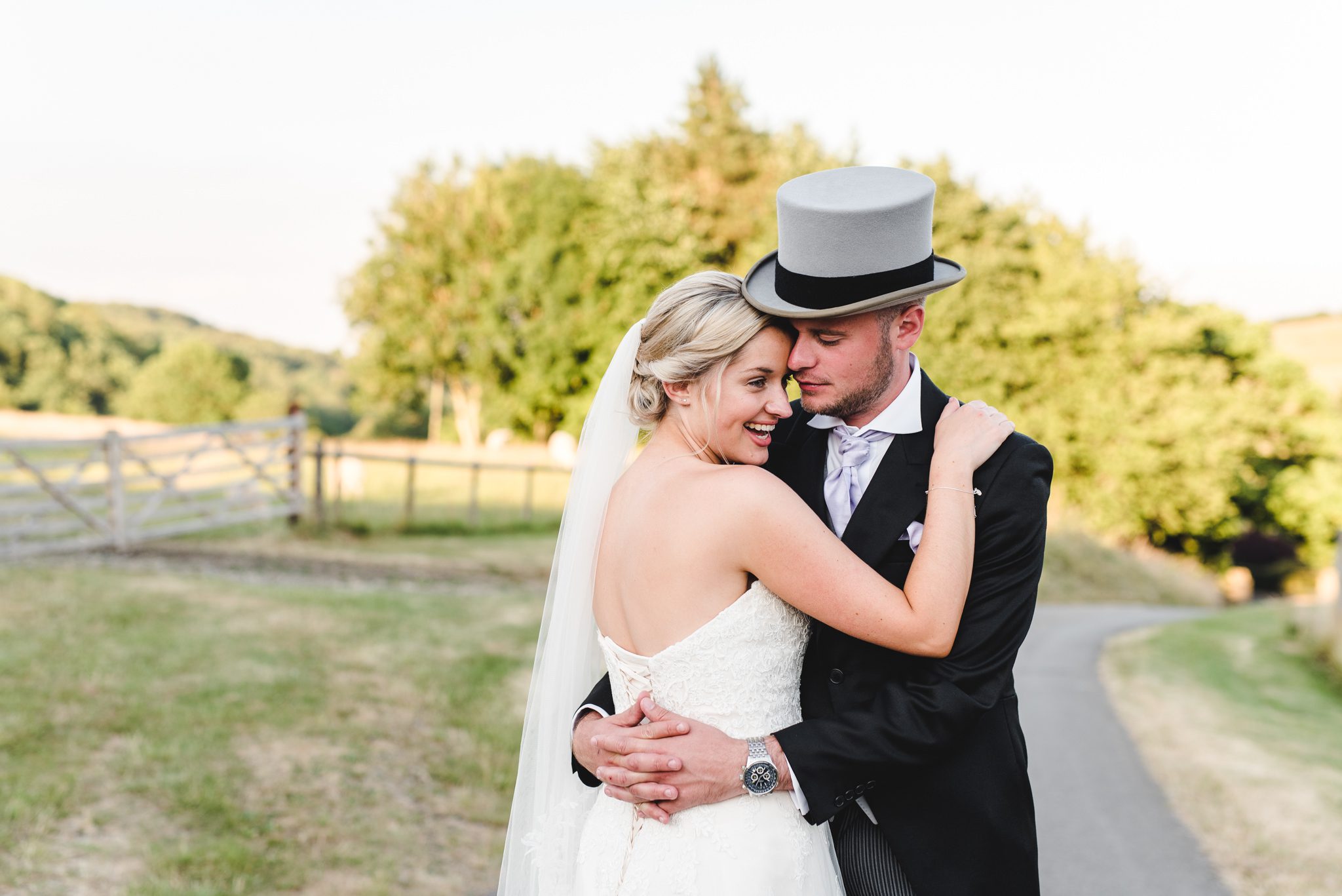 Couple photographs at kingscote barn