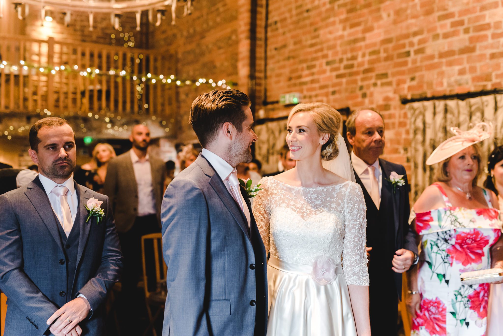 Bride and groom smiling at each other