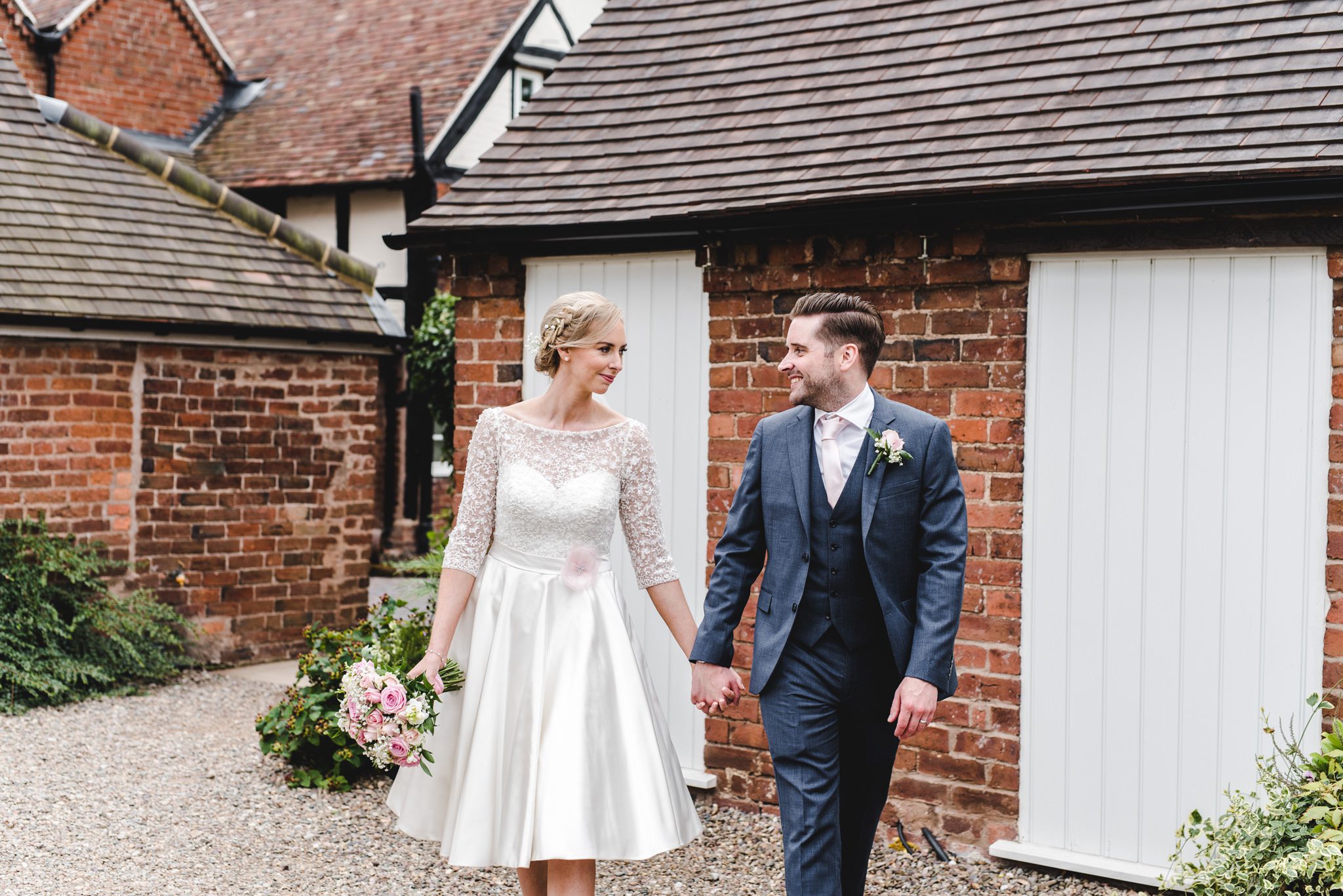 Bride and groom holding hands