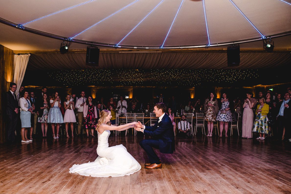 A first dance photo under the lights at Elmore Court