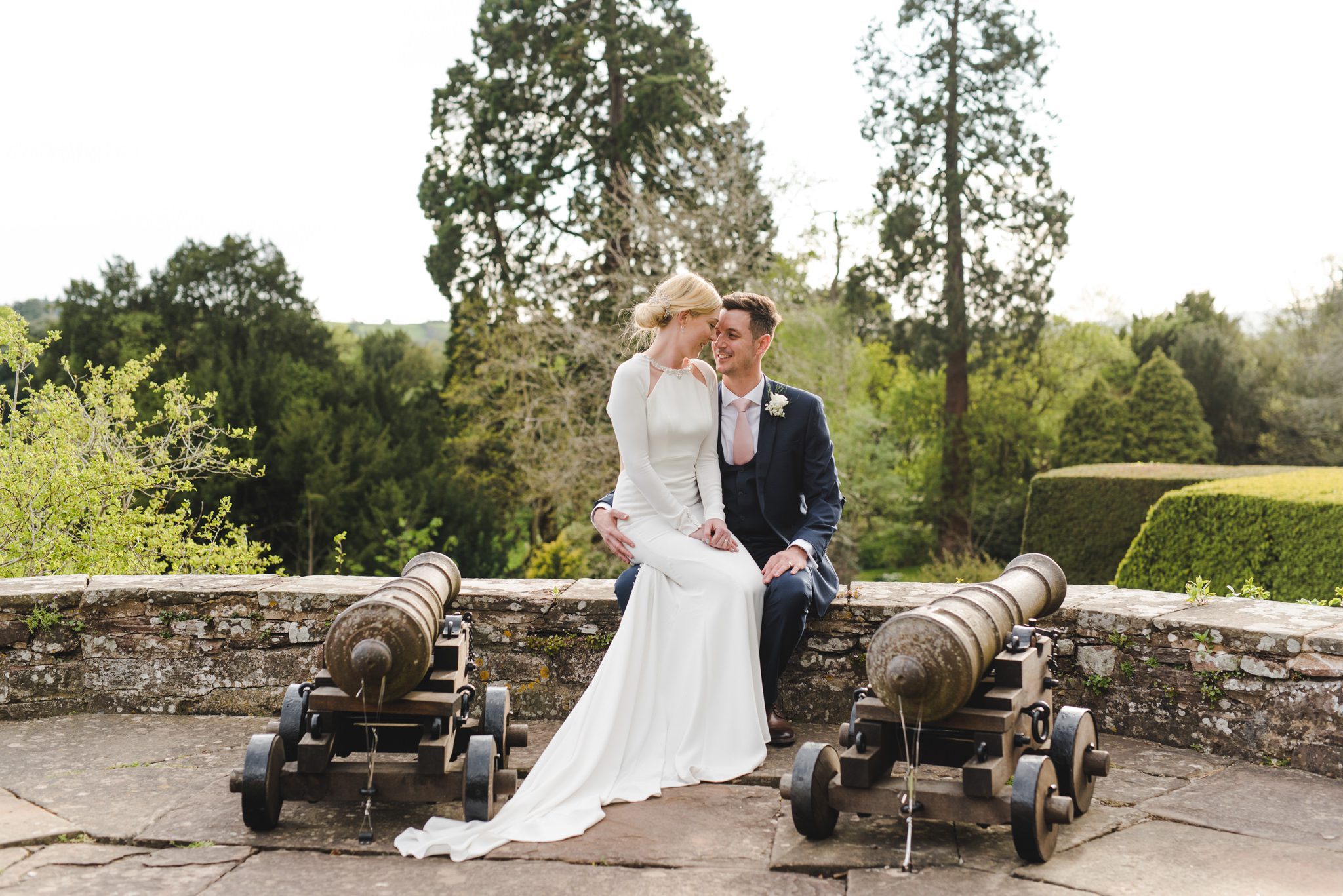 Bride and Groom sat on the canons at Berkeley Castle