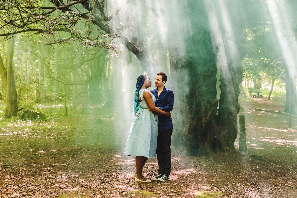 A couple standing in pretty light