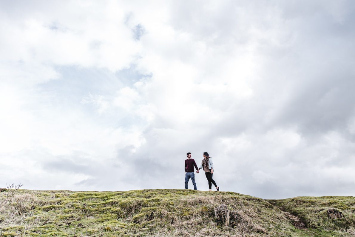 A couple walking on a hill