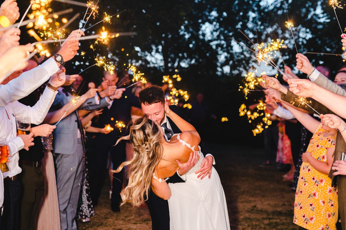 a dip during sparklers at a wedding