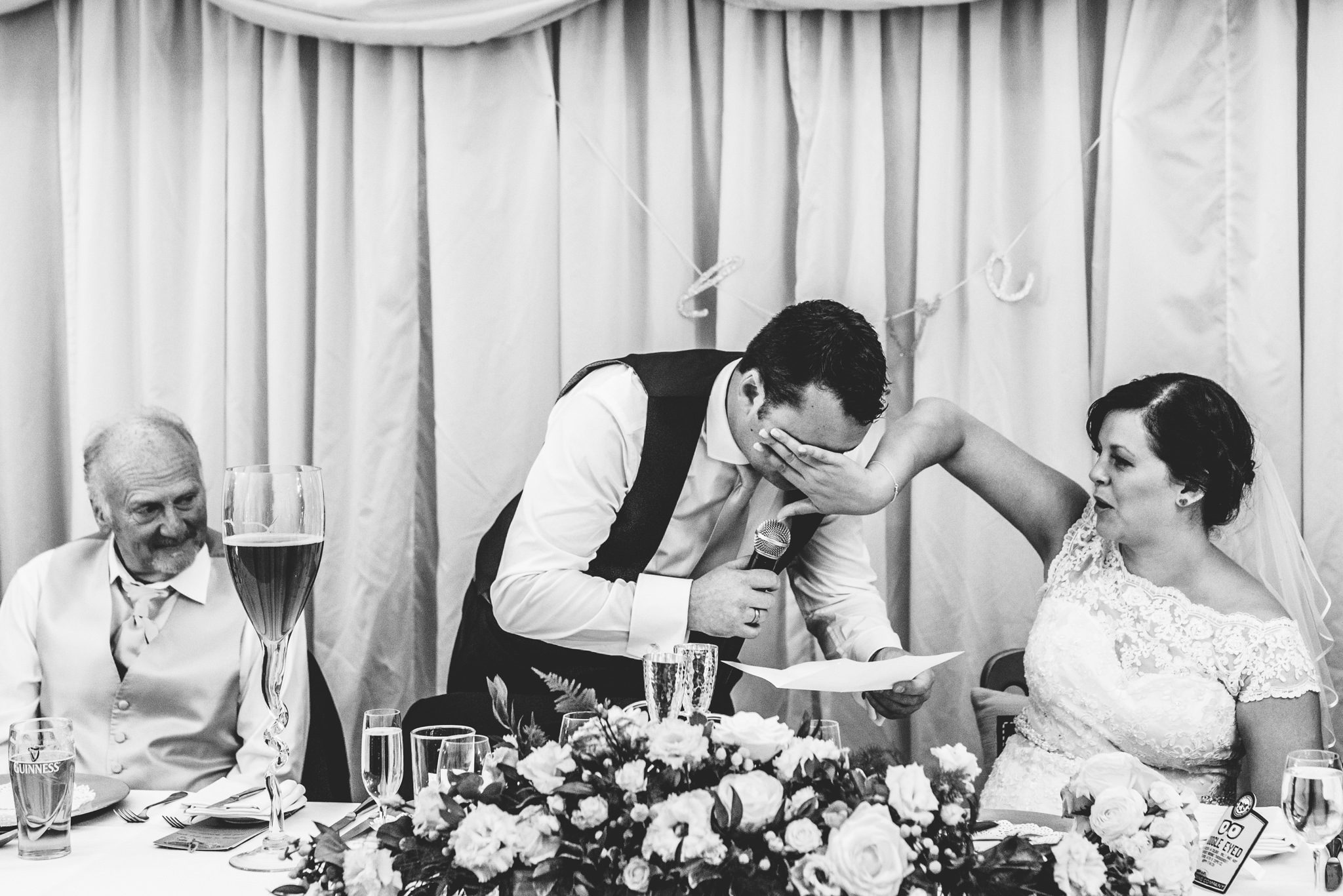 A bride wiping a tear from her groom at their Birtsmorton Court wedding day
