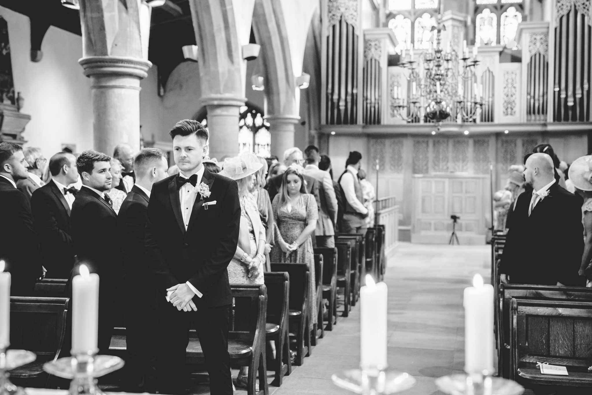 A groom in church waiting for his bride