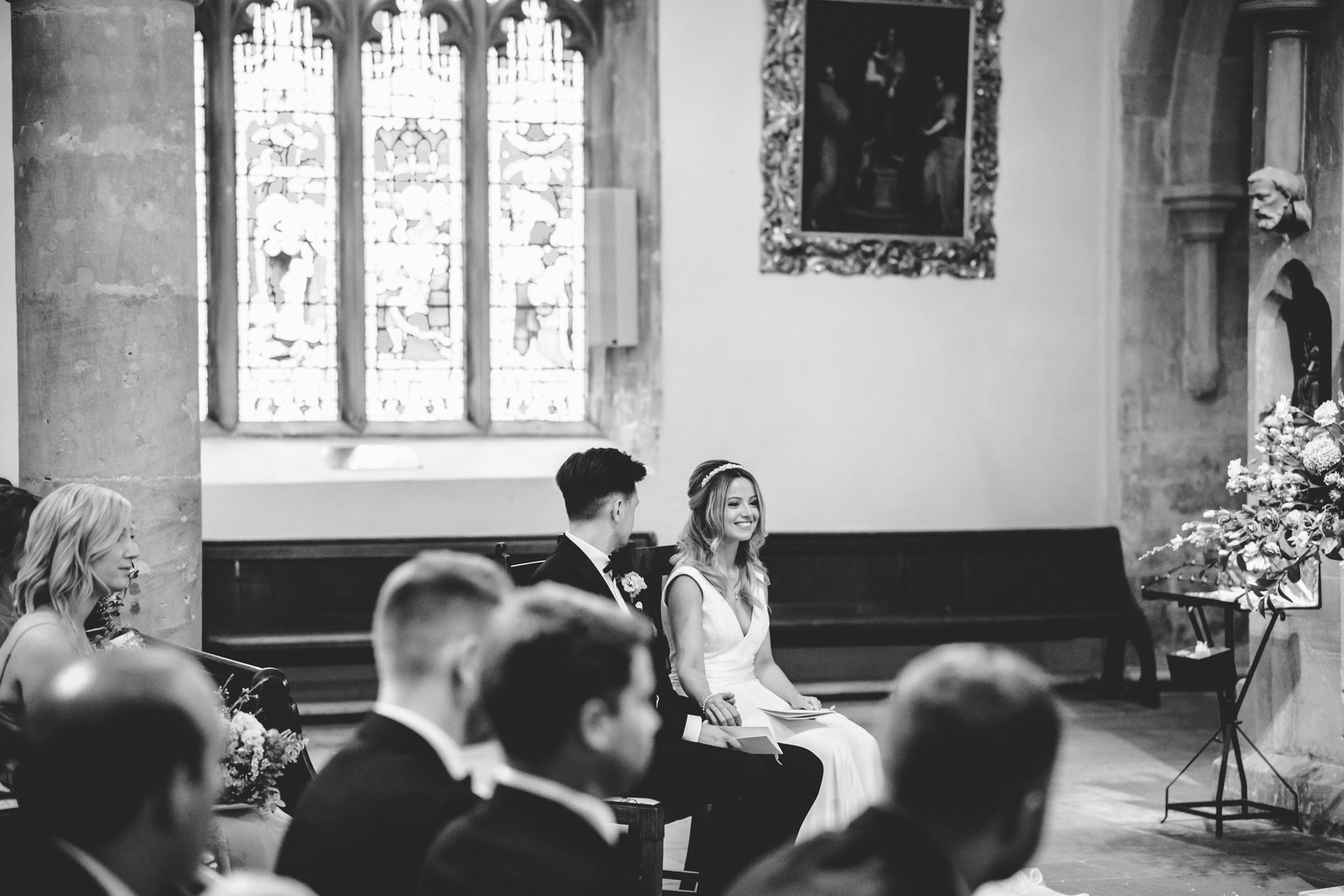 A bride laughing at her wedding speeches