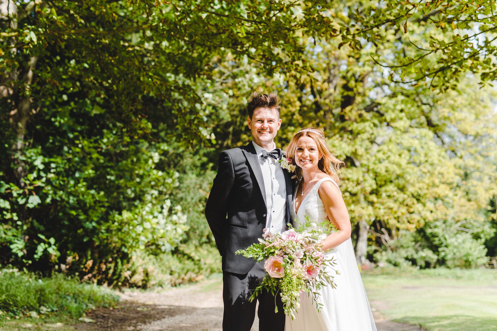 A bride and groom looking at the camera