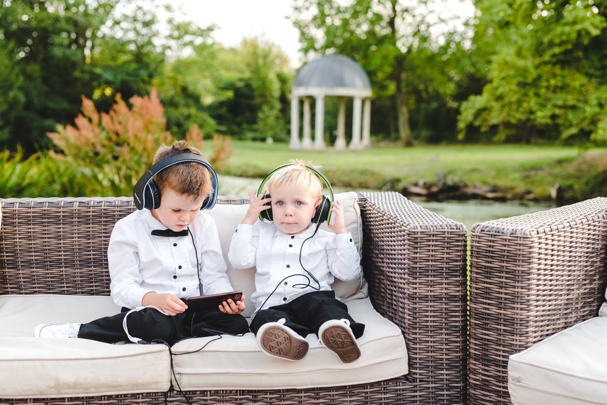 Children at a wedding with headphones on during the speeches