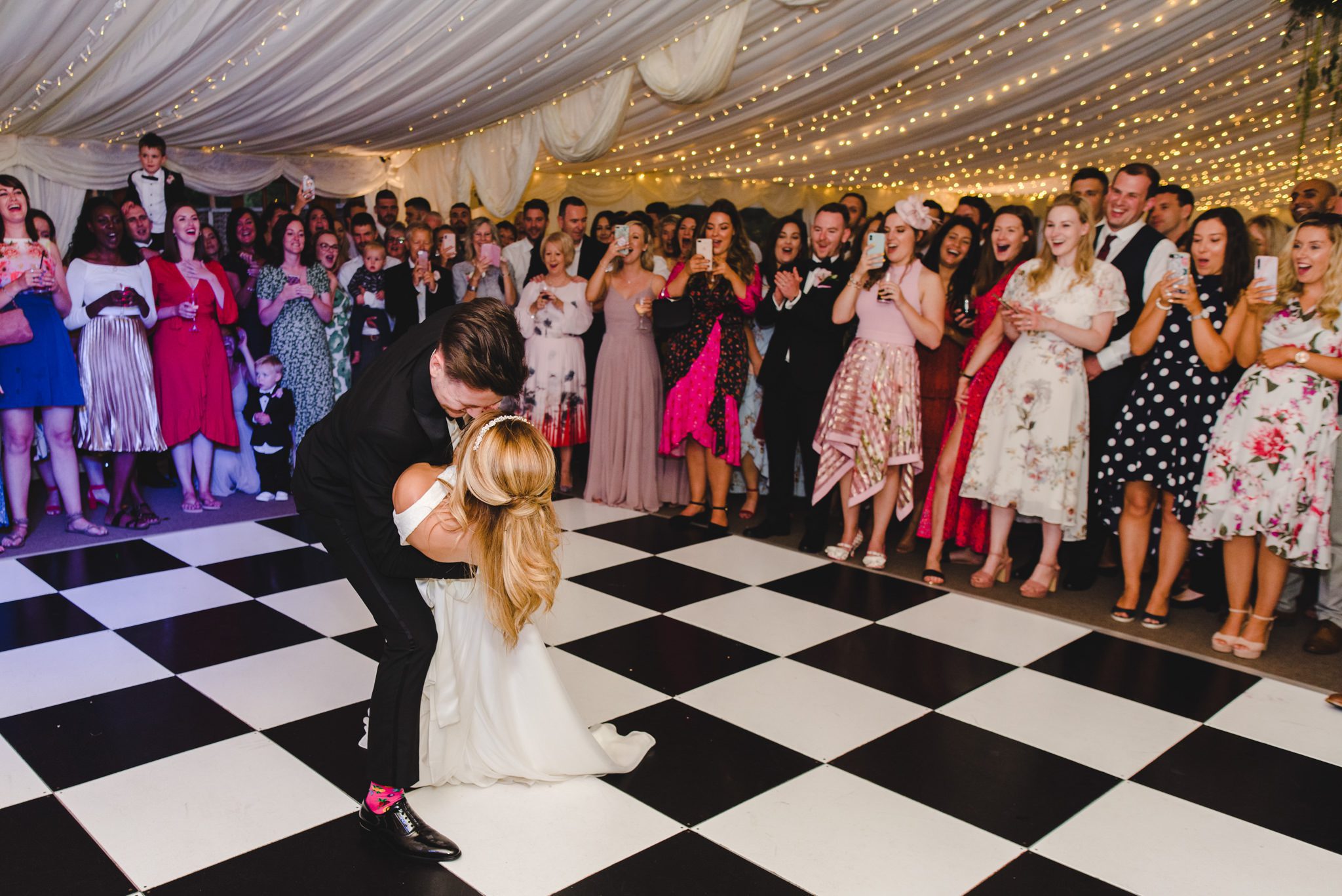 A bride holding a pose on teh dancefloor