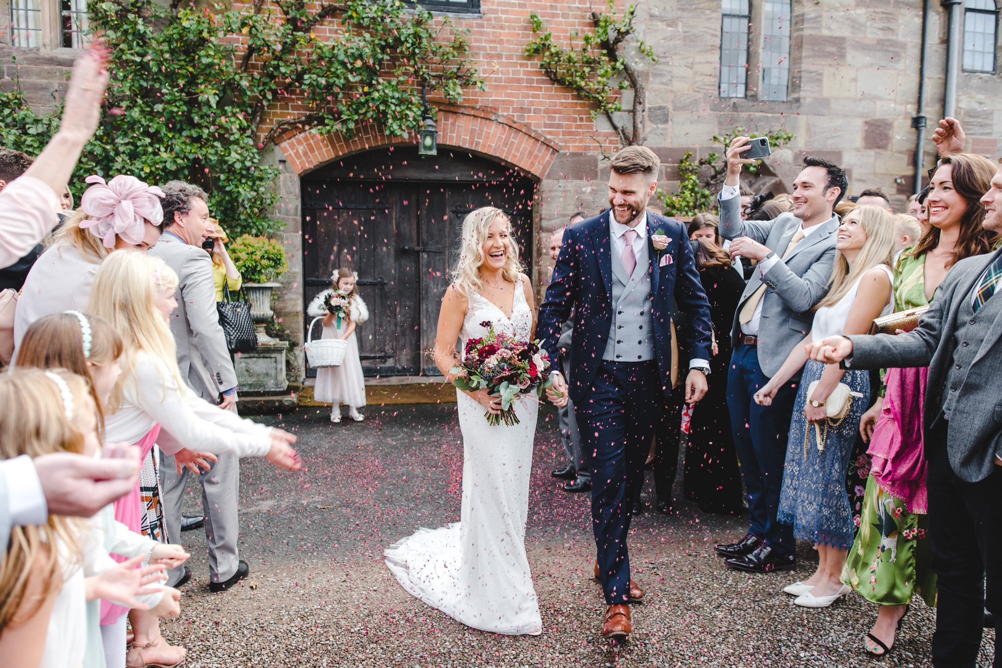 Confetti throwing on the bride and groom at Brinsop Court