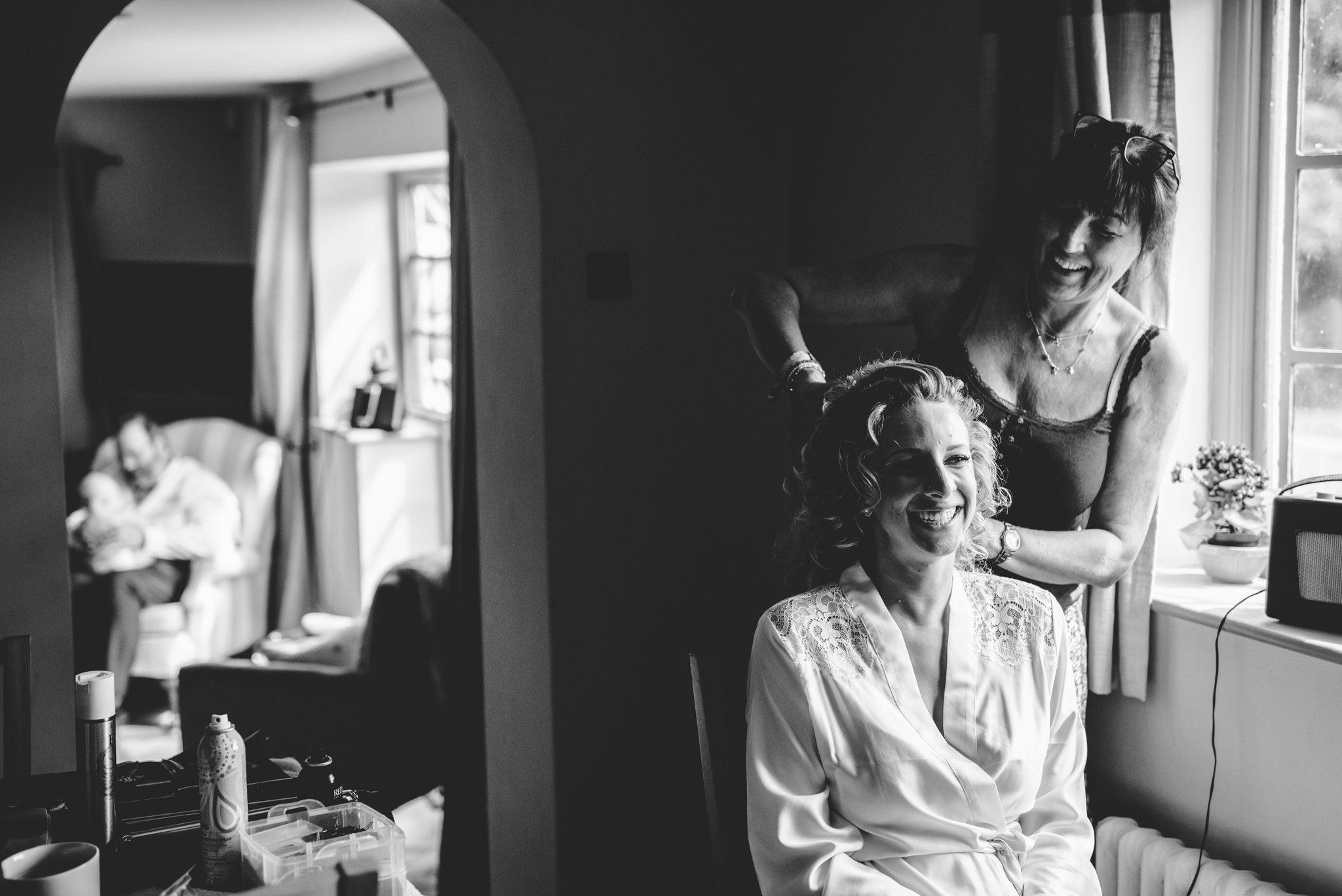 Black and white image of the bride getting ready for her wedding