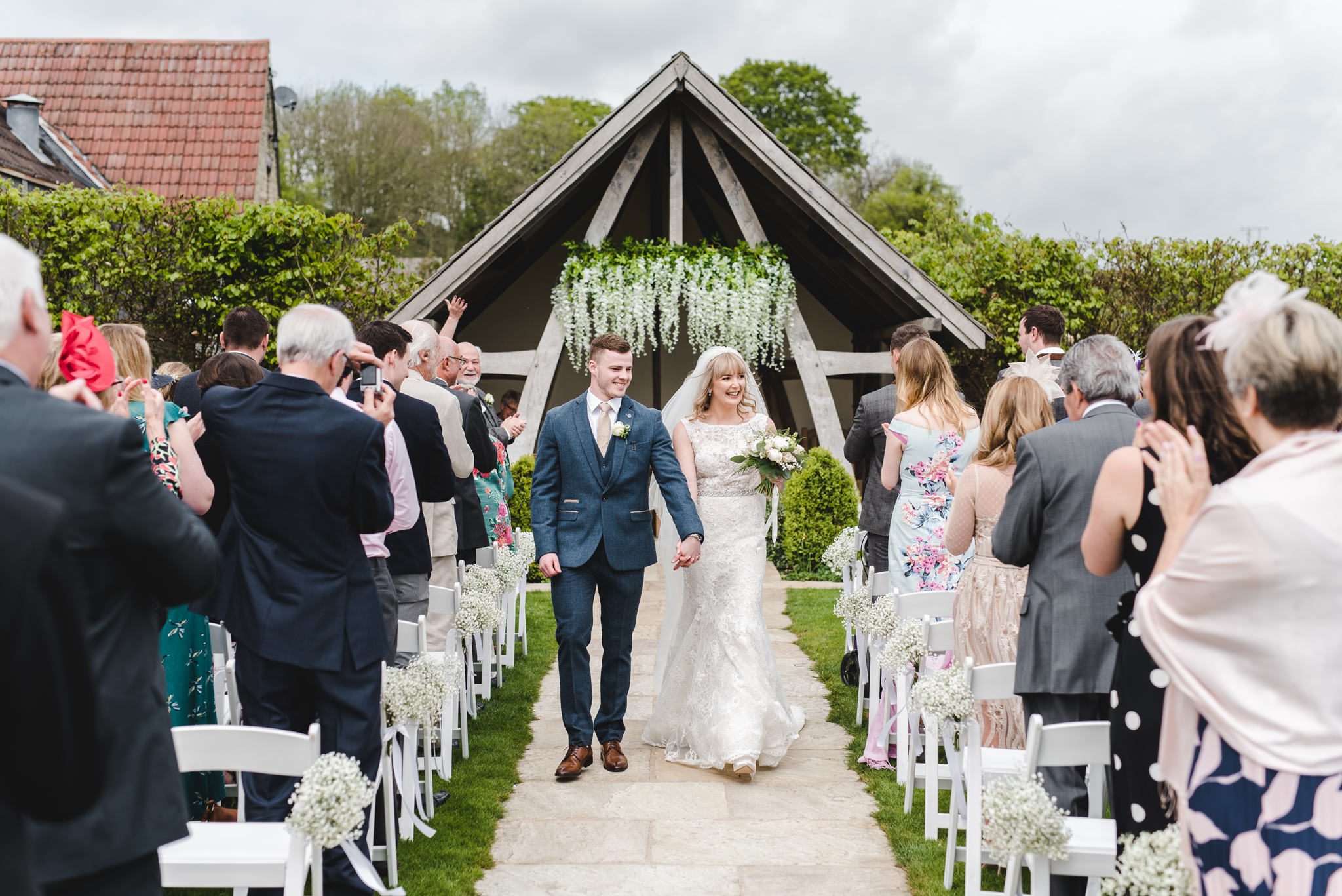 Ceremony exit with confetti outdoor at Kingscote