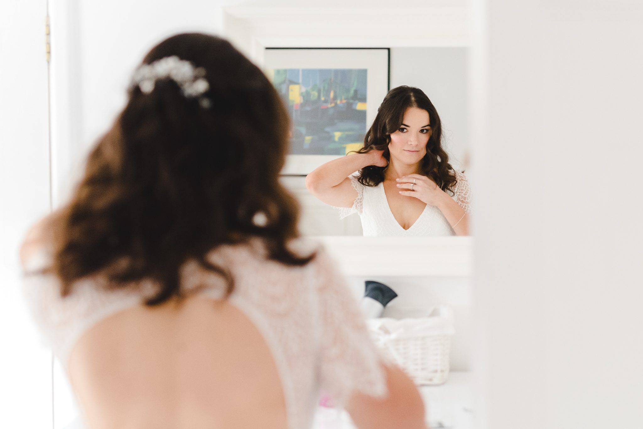 A bride looking in a mirror